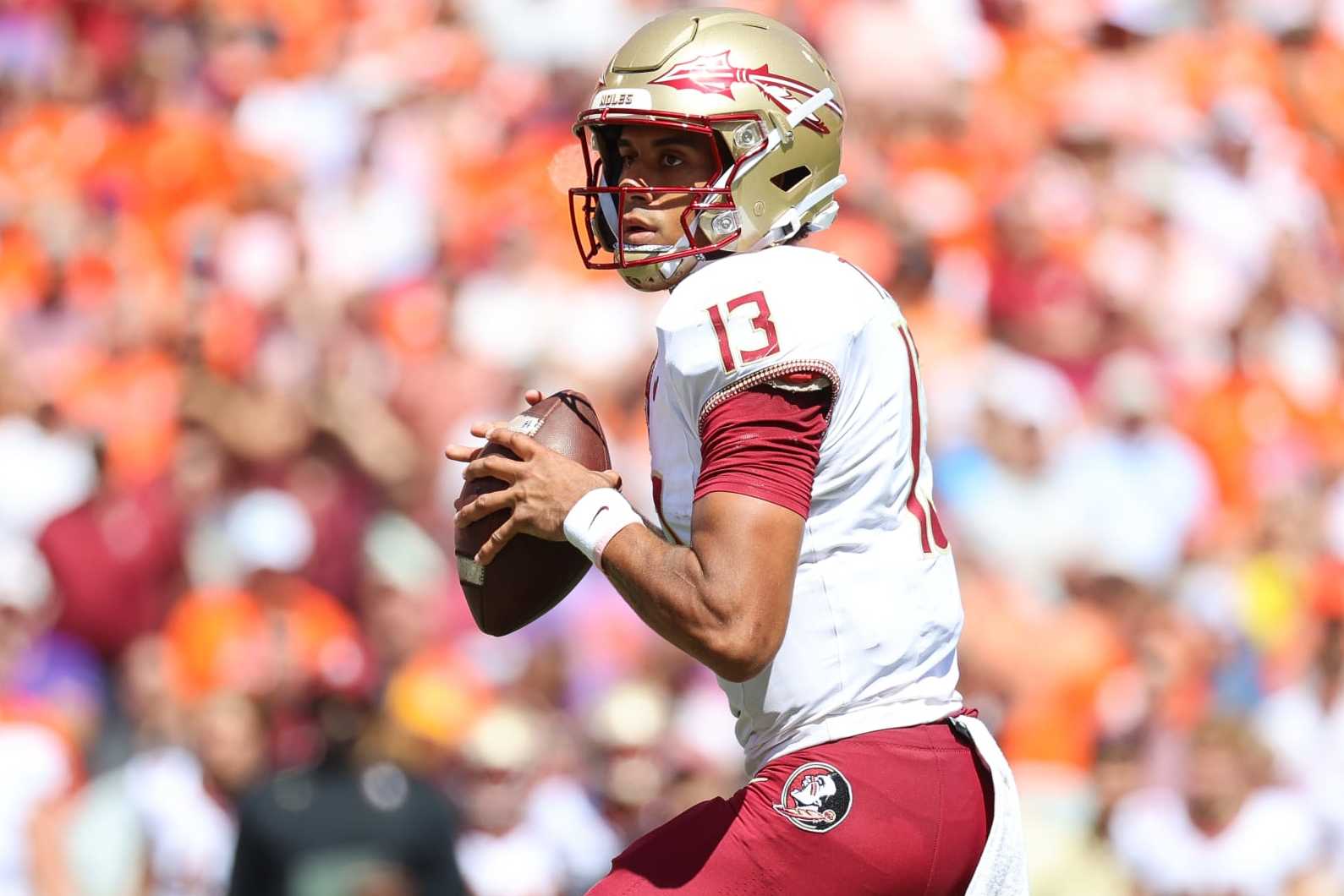 CLEMSON, SOUTH CAROLINA - SEPTEMBER 23: Jordan Travis #13 of the Florida State Seminoles looks to pass the ball against the Clemson Tigers during the second quarter at Memorial Stadium on September 23, 2023 in Clemson, South Carolina. (Photo by Isaiah Vazquez/Getty Images)