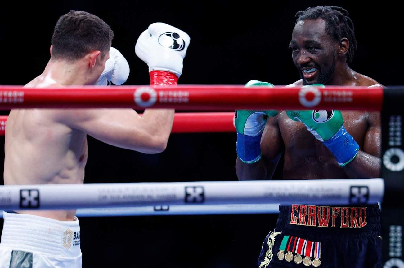 LOS ANGELES, CALIFORNIA - AUGUST 3: Terence Crawford smiles at Israel Madrimov during the tenth round of the WBA junior middleweight title bout at BMO Stadium on August 3, 2024 in Los Angeles, California. (Photo by Kevork Djansezian/Getty Images)