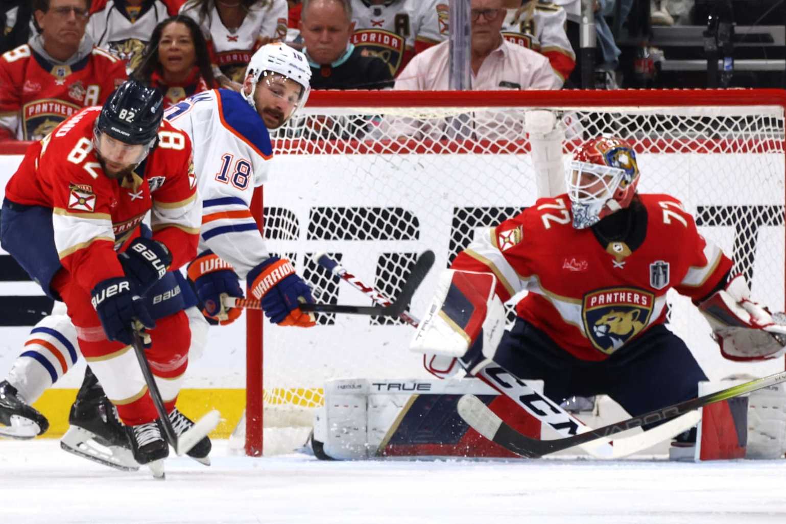 SUNRISE, FLORIDA - JUNE 24: Zach Hyman #18 of the Edmonton Oilers and Kevin Stenlund #82 of the Florida Panthers vie for position near the net of Sergei Bobrovsky #72 of the Florida Panthers during the second period of Game Seven of the 2024 Stanley Cup Final between the Edmonton Oilers and the Florida Panthers at Amerant Bank Arena on June 24, 2024 in Sunrise, Florida. (Photo by Dave Sandford/NHLI via Getty Images)