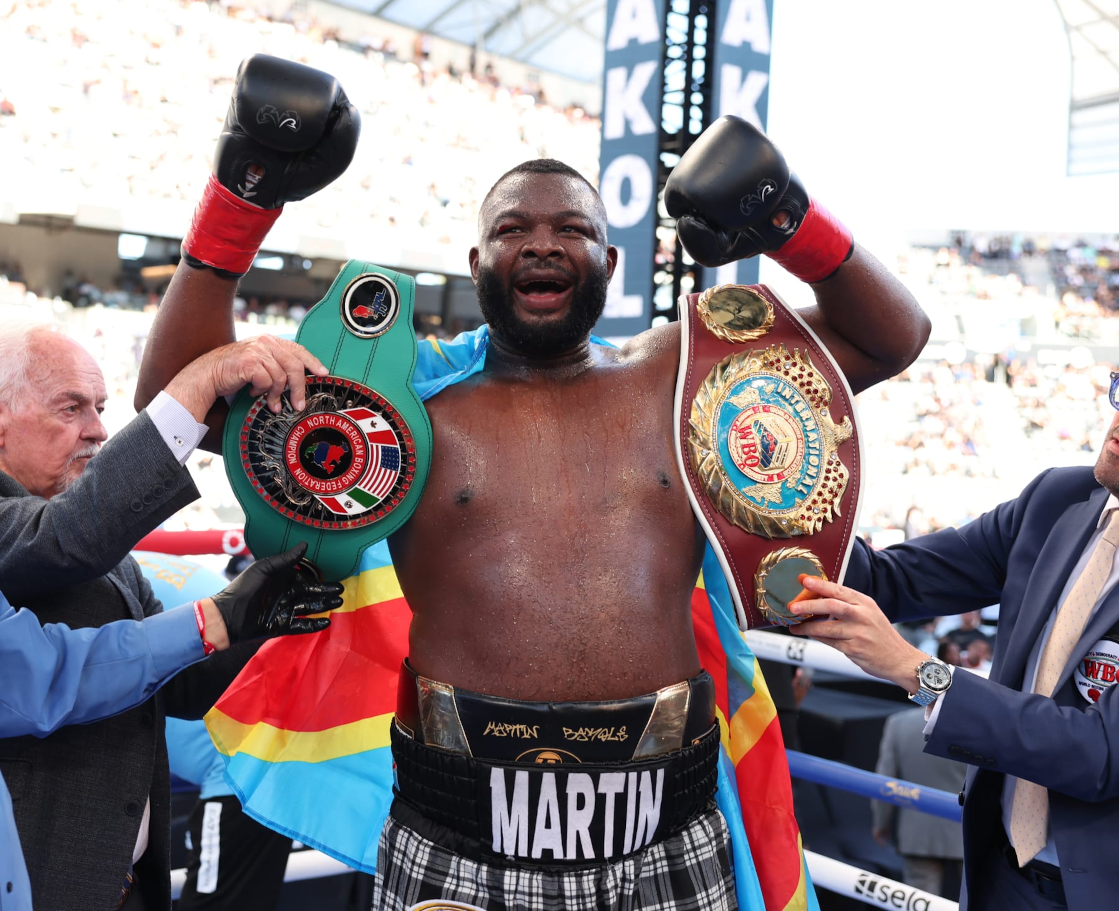 LOS ANGELES, CALIFORNIA - AUGUST 03: Martin Bakole (Tartan shorts) defeats Jared Anderson (white and blue shorts) to win the NABF WBO International Heavyweight Title Contest at BMO Stadium on August 3, 2024 in Los Angeles, California.  (Photo by Mark Robinson/Matchroom Boxing/Getty Images)