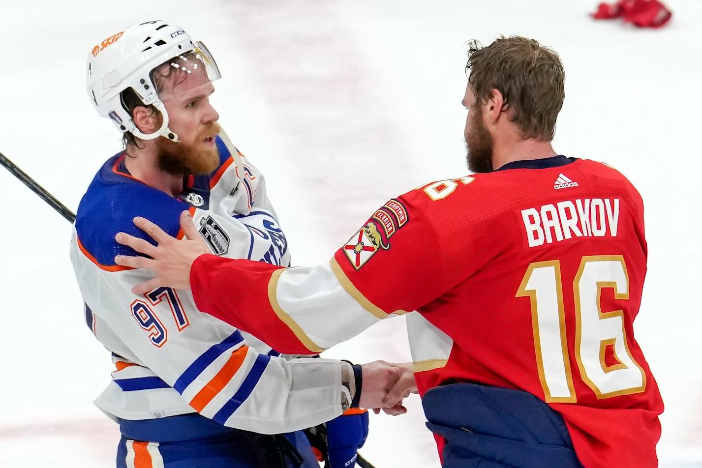 SUNRISE, FL - JUNE 24: Edmonton Oilers center Connor McDavid (97) and Florida Panthers center Aleksander Barkov (16) meet for a hand shake at center ice during the NHL Stanley Cup Finals, Game 7 between the Florida Panthers and Edmonton Oilers on June 24th, 2024 at Amerant Bank Arena in Sunrise, FL. (Photo by Andrew Bershaw/Icon Sportswire via Getty Images)