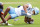 CHARLOTTESVILLE, VA - NOVEMBER 05: Josh Downs #11 of the North Carolina Tar Heels slips while defended by Coen King #9 of the Virginia Cavaliers in the first half during a game at Scott Stadium on November 5, 2022 in Charlottesville, Virginia. (Photo by Ryan M. Kelly/Getty Images)