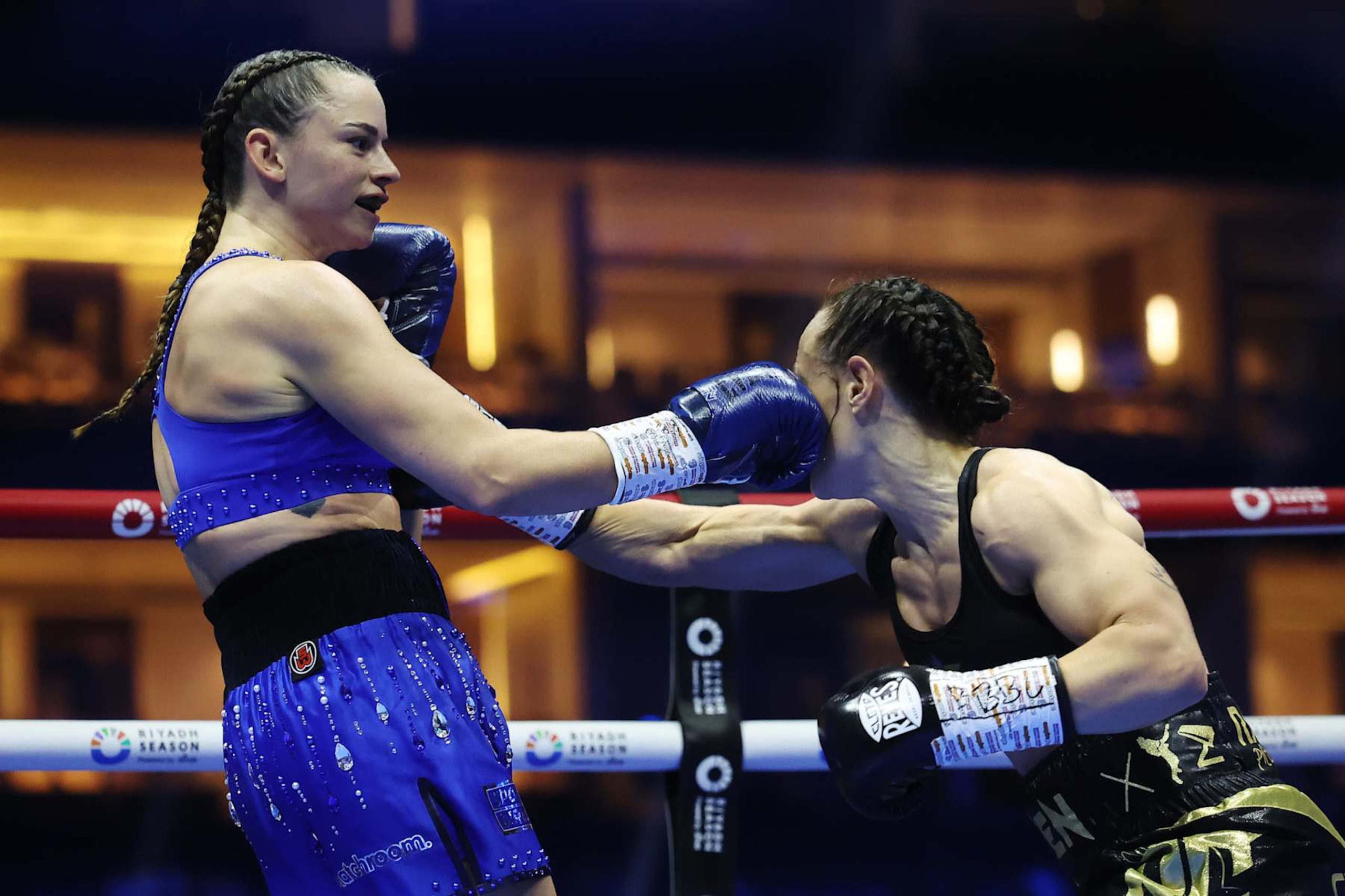 RIYADH, SAUDI ARABIA - OCTOBER 12: Skye Nicolson punches Raven Chapman during the Women's WBC World Featherweight title fight between Skye Nicolson and Raven Chapman as part of the Riyadh Season - IV Crown Showdown card at Kingdom Arena on October 12, 2024 in Riyadh. (Photo by Richard Pelham/Getty Images)