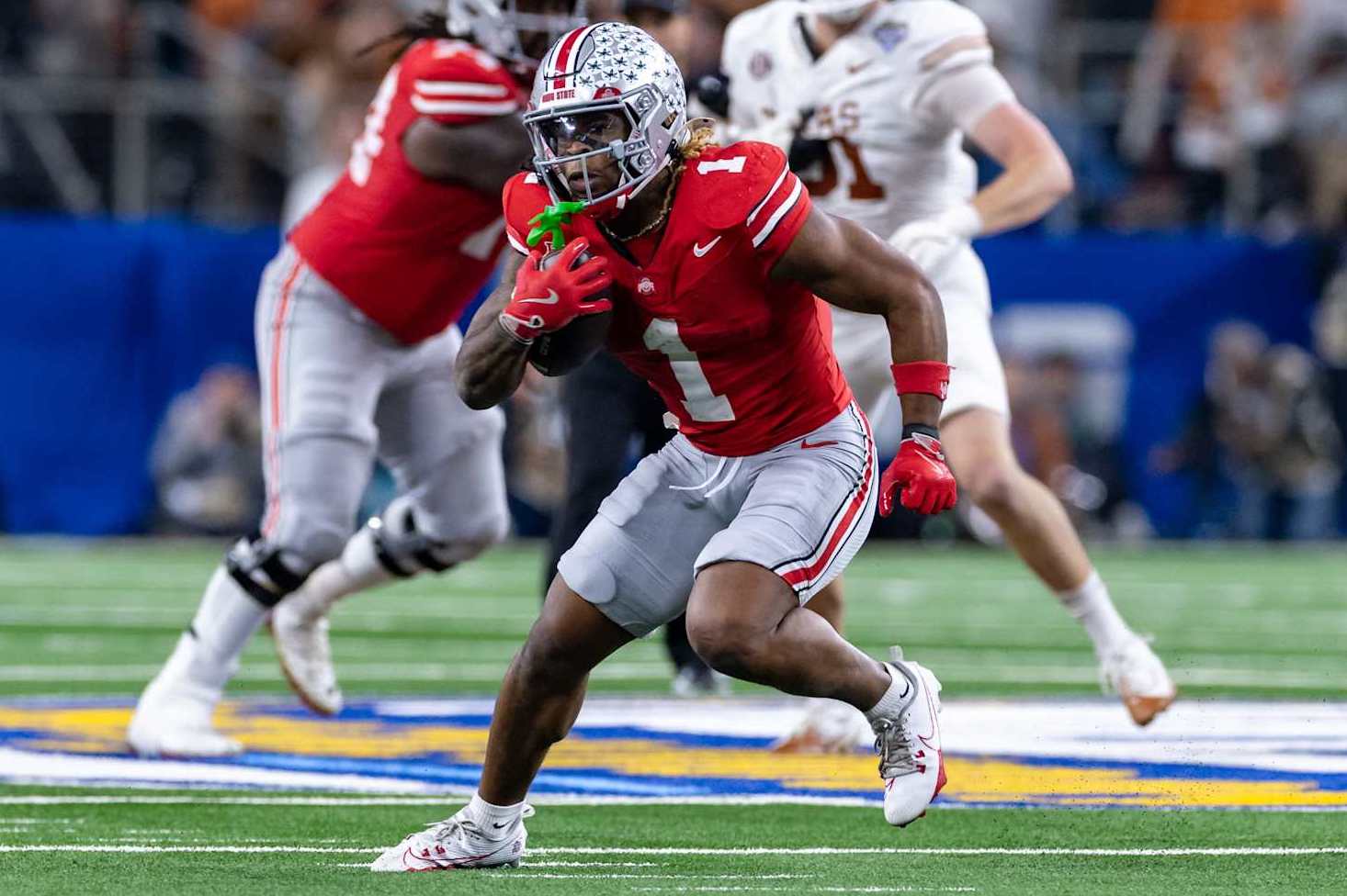 ARLINGTON, TX - JANUARY 10: Ohio State Buckeyes running back Quinshon Judkins (#1) runs up field during the CFP Semifinal Cotton Bowl Classic football game between the Ohio State Buckeyes and Texas Longhorns on January 10, 2025 at AT&T Stadium in Arlington, TX. (Photo by Matthew Visinsky/Icon Sportswire via Getty Images)