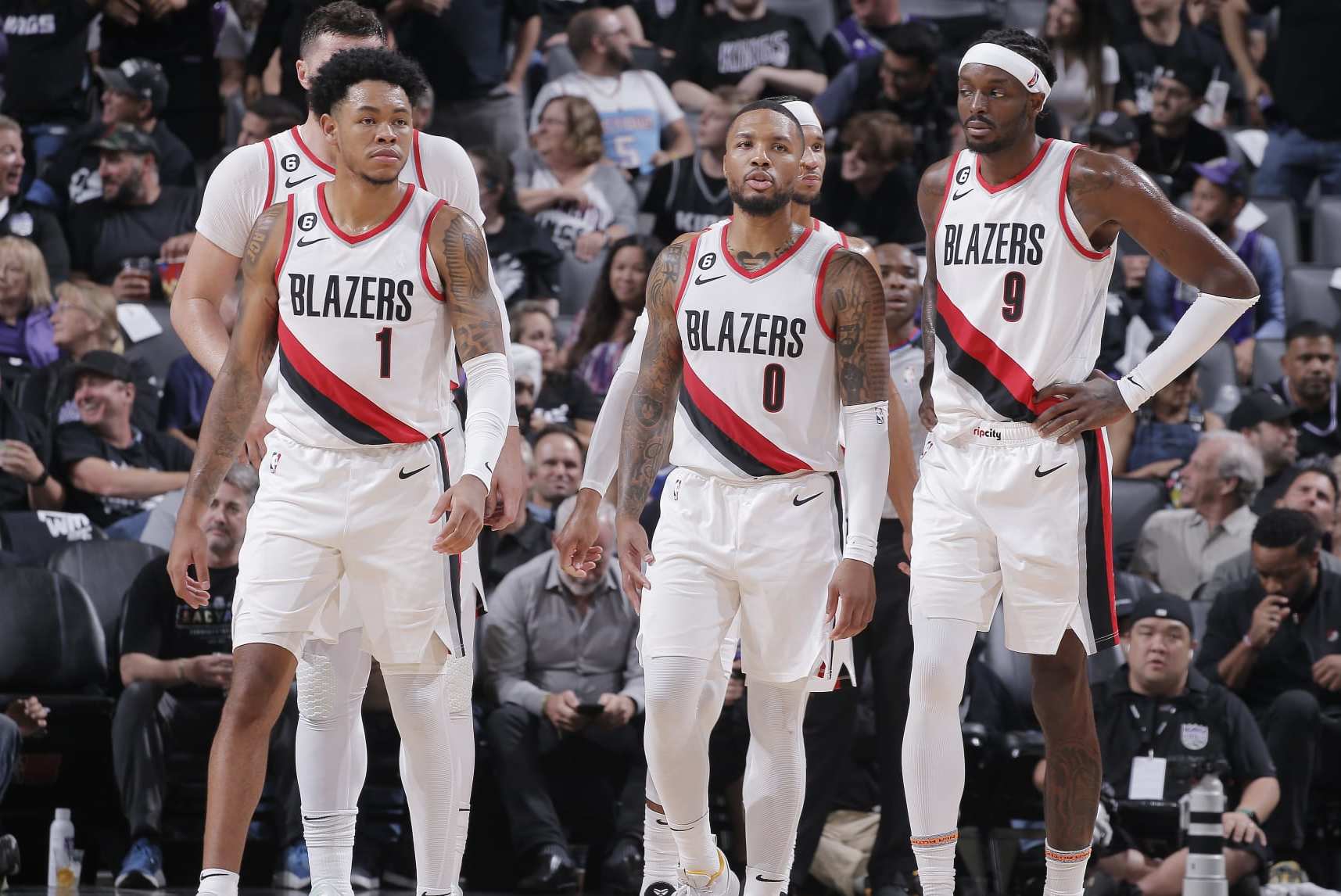 SACRAMENTO, CA - OCTOBER 19: Anfernee Simons #1, Damian Lillard #0, and Jerami Grant #9 of the Portland Trail Blazers look on during the game against the Sacramento Kings on October 19, 2022 at Golden 1 Center in Sacramento, California. NOTE TO USER: User expressly acknowledges and agrees that, by downloading and or using this photograph, User is consenting to the terms and conditions of the Getty Images Agreement. Mandatory Copyright Notice: Copyright 2022 NBAE (Photo by Rocky Widner/NBAE via Getty Images) SACRAMENTO, CA - OCTOBER 19: Anfernee Simons #1, Damian Lillard #0, and Jerami Grant #9 of the Portland Trail Blazers look on during the game against the Sacramento Kings on October 19, 2022 at Golden 1 Center in Sacramento, California. NOTE TO USER: User expressly acknowledges and agrees that, by downloading and or using this photograph, User is consenting to the terms and conditions of the Getty Images Agreement. Mandatory Copyright Notice: Copyright 2022 NBAE (Photo by Rocky Widner/NBAE via Getty Images)