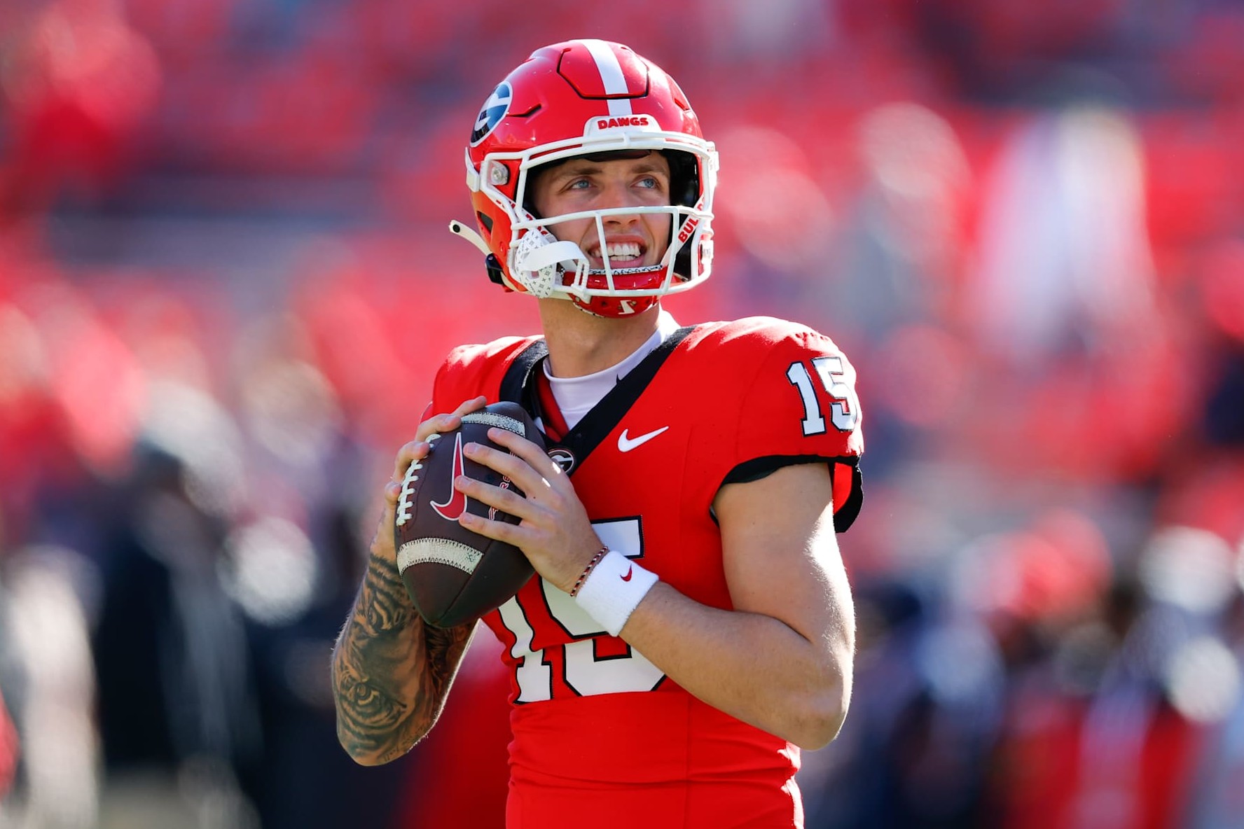 ATHENS, GEORGIA - NOVEMBER 23: Carson Beck #15 of the Georgia Bulldogs warms up prior to the game against the Massachusetts Minutemen at Sanford Stadium on November 23, 2024 in Athens, Georgia.  (Photo by Todd Kirkland/Getty Images)