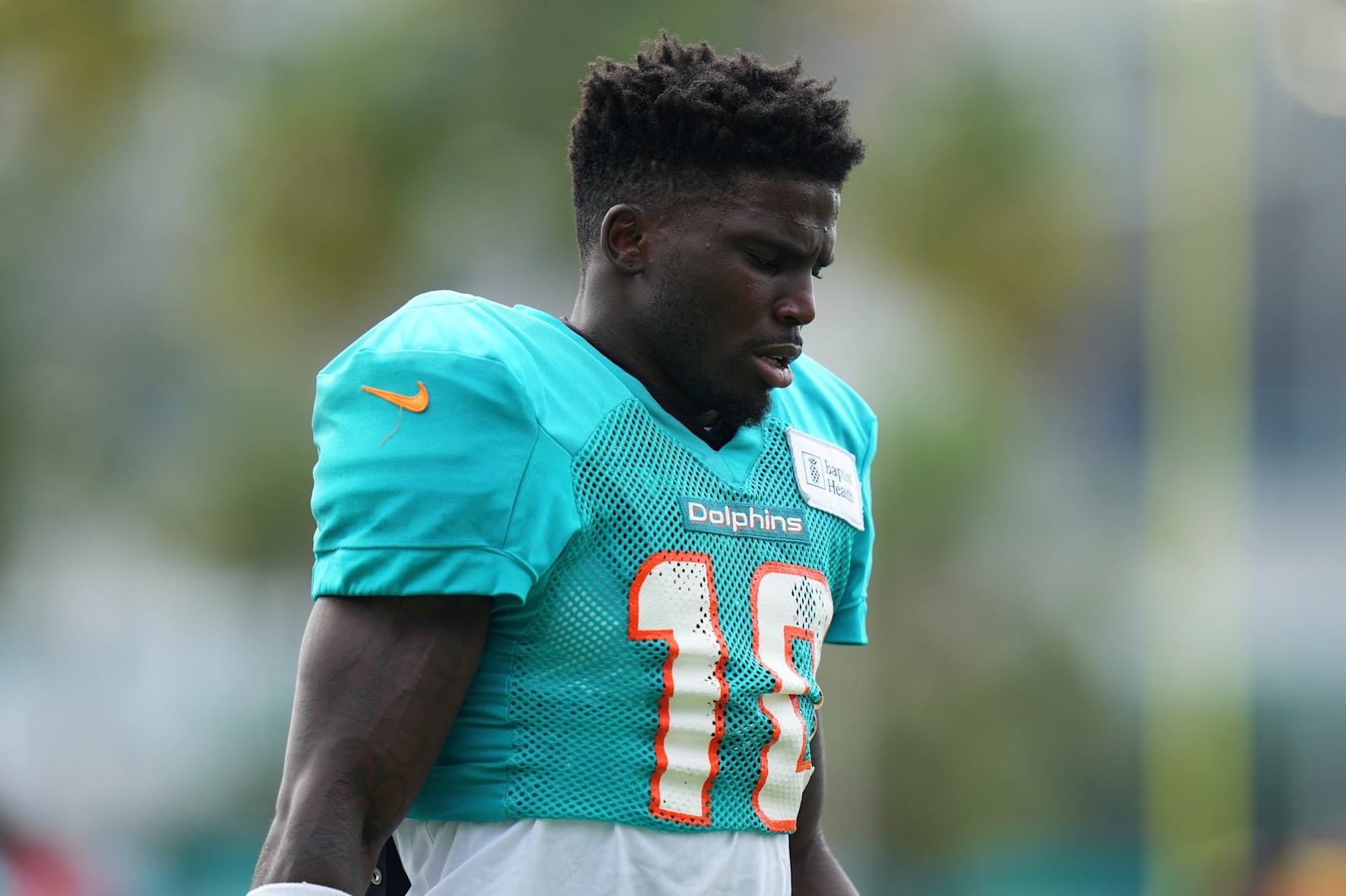 MIAMI GARDENS, FLORIDA - AUGUST 07: Tyreek Hill #10 of the Miami Dolphins looks on during training camp practice with the Atlanta Falcons on August 07, 2024 in Miami Gardens, Florida. (Photo by Rich Storry/Getty Images)