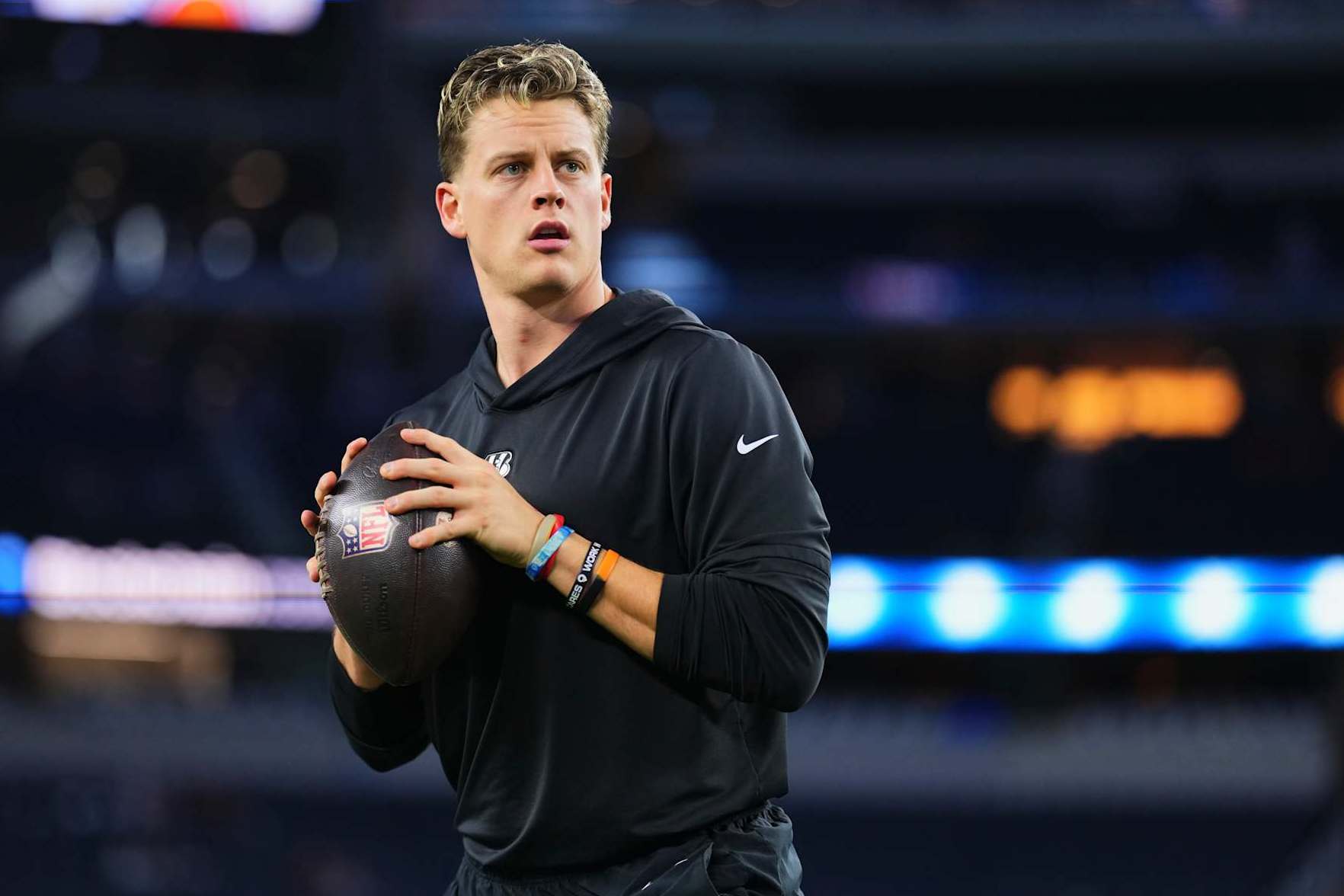 ARLINGTON, TX - DECEMBER 09: Joe Burrow #9 of the Cincinnati Bengals warms up before kickoff of an NFL football game against the Dallas Cowboys at AT&T Stadium on December 9, 2024 in Arlington, Texas. (Photo by Cooper Neill/Getty Images)