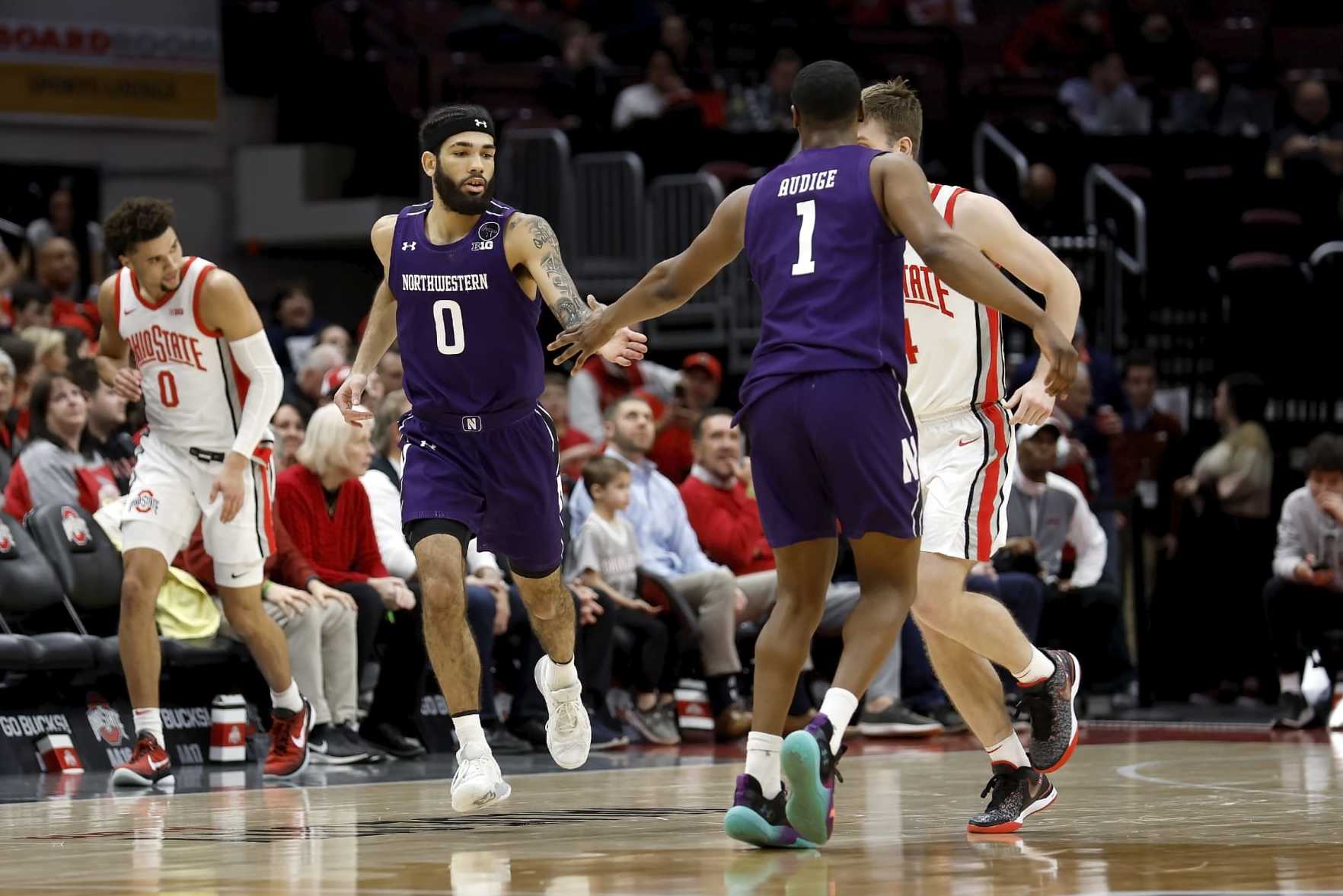 COLUMBUS, OH - FEBRUARY 09:  Boo Buie #0 of the Northwestern Wildcats is congratulated by Chase Audige #1 after making a shot during the game against the Ohio State Buckeyes at the Jerome Schottenstein Center on February 9, 2023 in Columbus, Ohio. (Photo by Kirk Irwin/Getty Images)