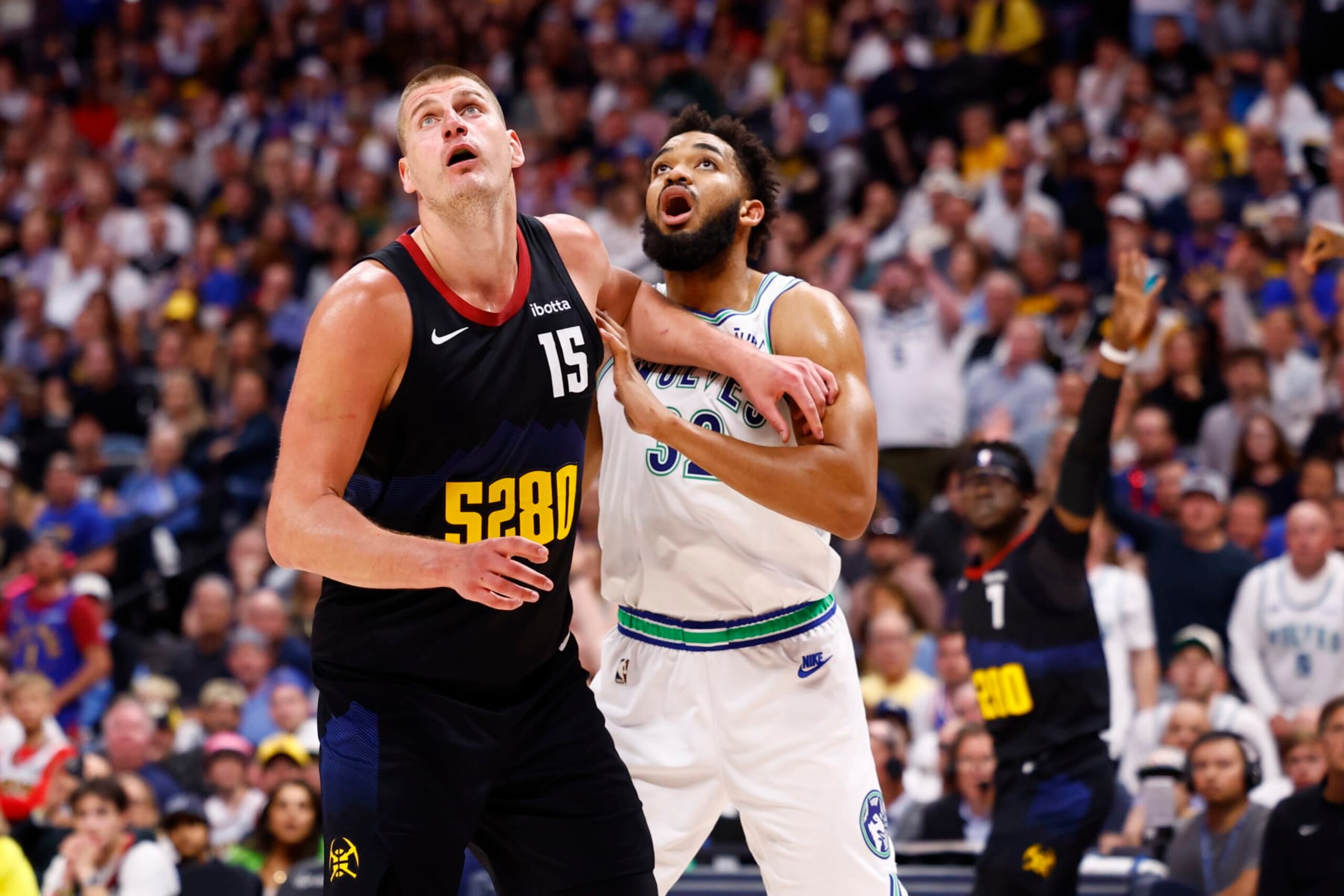 DENVER, COLORADO - MAY 19: Nikola Jokic #15 of the Denver Nuggets and Karl-Anthony Towns #32 of the Minnesota Timberwolves anticipate a rebound during Game Seven of the Western Conference Second Round Playoffs at Ball Arena on May 19, 2024 in Denver, Colorado. NOTE TO USER: User expressly acknowledges and agrees that, by downloading and or using this photograph, User is consenting to the terms and conditions of the Getty Images License Agreement. (Photo by C. Morgan Engel/Getty Images)