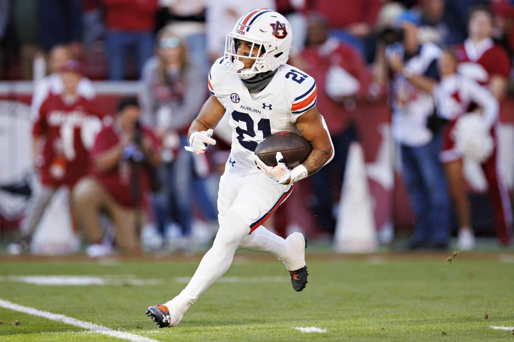 FAYETTEVILLE, ARKANSAS - NOVEMBER 11: Brian Battie #21 of the Auburn Tigers runs the ball during the game against the Arkansas Razorbacks at Donald W. Reynolds Razorback Stadium on November 11, 2023 in Fayetteville, Arkansas. The Tigers defeated the Razorbacks 48-10. (Photo by Wesley Hitt/Getty Images)