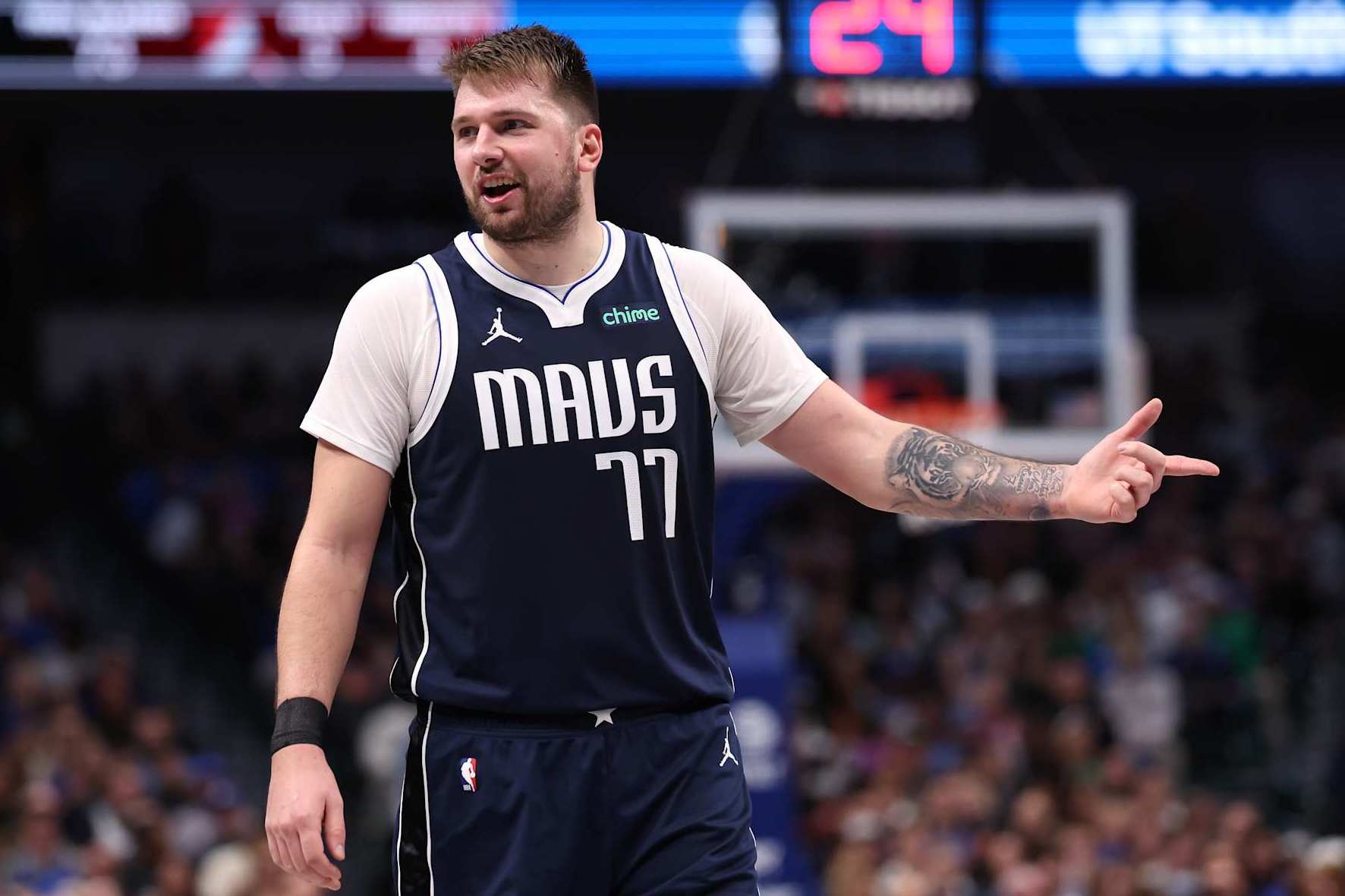 DALLAS, TEXAS - DECEMBER 23: Luka Doncic #77 of the Dallas Mavericks reacts during the second half against the Portland Trail Blazers at American Airlines Center on December 23, 2024 in Dallas, Texas. NOTE TO USER: User expressly acknowledges and agrees that, by downloading and/or using this photograph, user is consenting to the terms and conditions of the Getty Images License Agreement. (Photo by Sam Hodde/Getty Images)