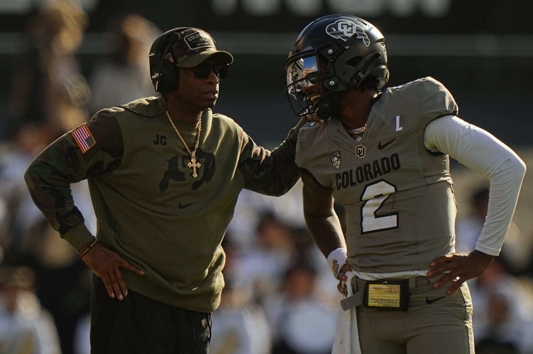 College Football: Colorado head coach Deion Sanders talks with quarterback Shedeur Sanders (2) vs Arizona at Folsom Field. 
Boulder, CO 11/11/2023 
CREDIT: Erick W. Rasco (Photo by Erick W. Rasco/Sports Illustrated via Getty Images) 
(Set Number: X164462)