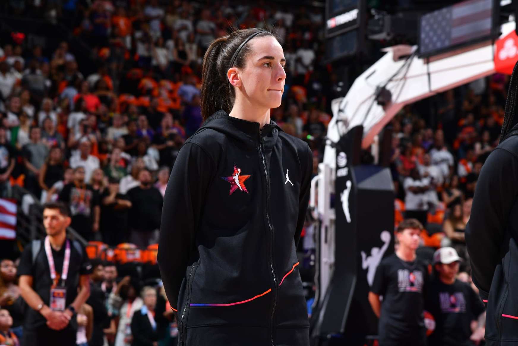 PHOENIX, AZ - JULY 20: Caitlin Clark #22 of Team WNBA stands for the National Anthem before the game against the USA Basketball Women's National Team during the 2024 WNBA All Star Game on July 20, 2024 at Footprint Center in Phoenix, Arizona. NOTE TO USER: User expressly acknowledges and agrees that, by downloading and or using this photograph, user is consenting to the terms and conditions of the Getty Images License Agreement. Mandatory Copyright Notice: Copyright 2024 NBAE (Photo by Barry Gossage/NBAE via Getty Images)