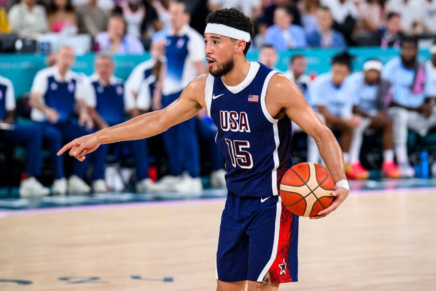 PARIS, FRANCE - AUGUST 10: Devin Booker of Team United States handles the ball during the Men's Gold Medal game between Team France and Team United States on day fifteen of the Olympic Games Paris 2024 at the Bercy Arena on August 10, 2024 in Paris, France. (Photo by Tom Weller/VOIGT/GettyImages)