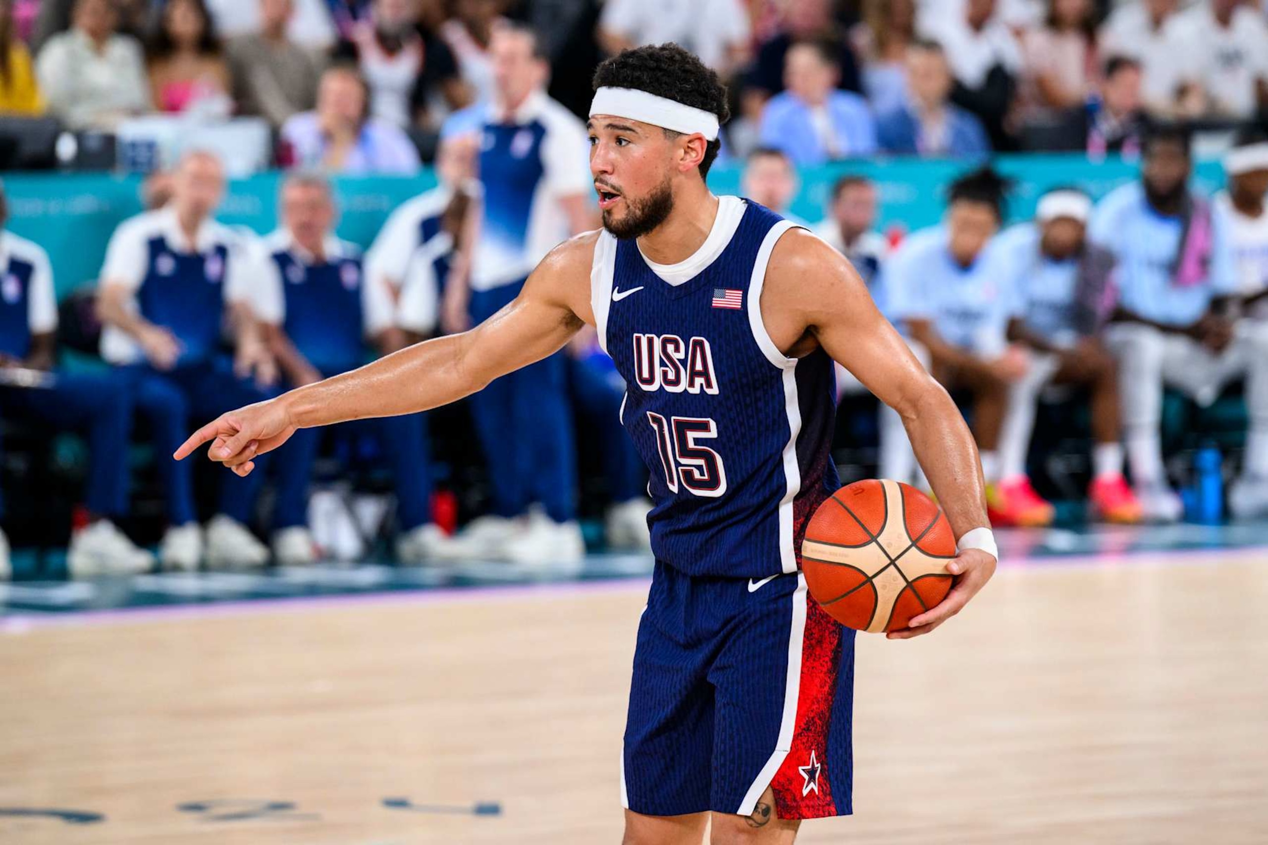 PARIS, FRANCE - AUGUST 10: Devin Booker of Team United States handles the ball during the Men's Gold Medal game between Team France and Team United States on day fifteen of the Olympic Games Paris 2024 at the Bercy Arena on August 10, 2024 in Paris, France. (Photo by Tom Weller/VOIGT/GettyImages)