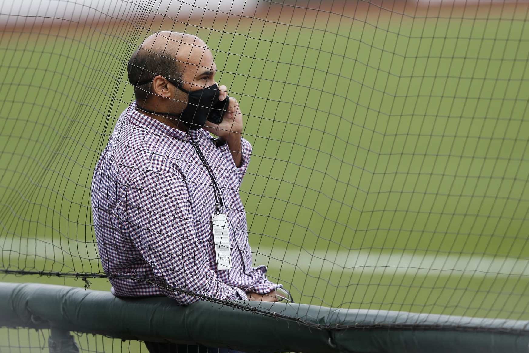 SAN FRANCISCO, CALIFORNIA - AUGUST 26: President of Baseball Operations Farhan Zaidi of the San Francisco Giants talks on the phone before the postponement of the game against the Los Angeles Dodgers at Oracle Park on August 26, 2020 in San Francisco, California. Several sporting leagues across the nation today are postponing their schedules as players protest the shooting of Jacob Blake by Kenosha, Wisconsin police. (Photo by Lachlan Cunningham/Getty Images)