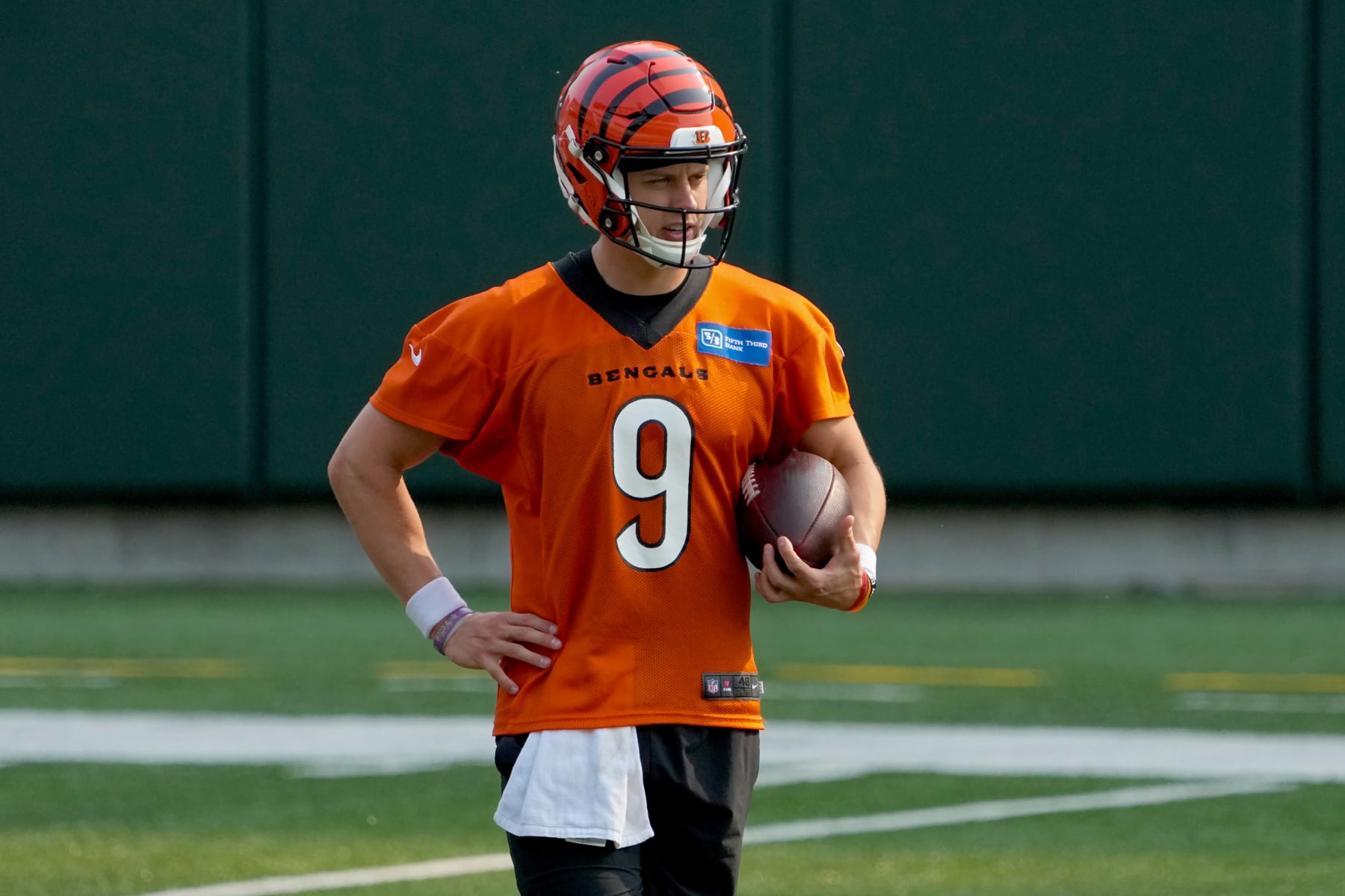 CINCINNATI, OHIO - JUNE 15: Joe Burrow #9 of the Cincinnati Bengals walks across the field during an offseason workout at Paycor Stadium on June 15, 2023 in Cincinnati, Ohio. (Photo by Dylan Buell/Getty Images)