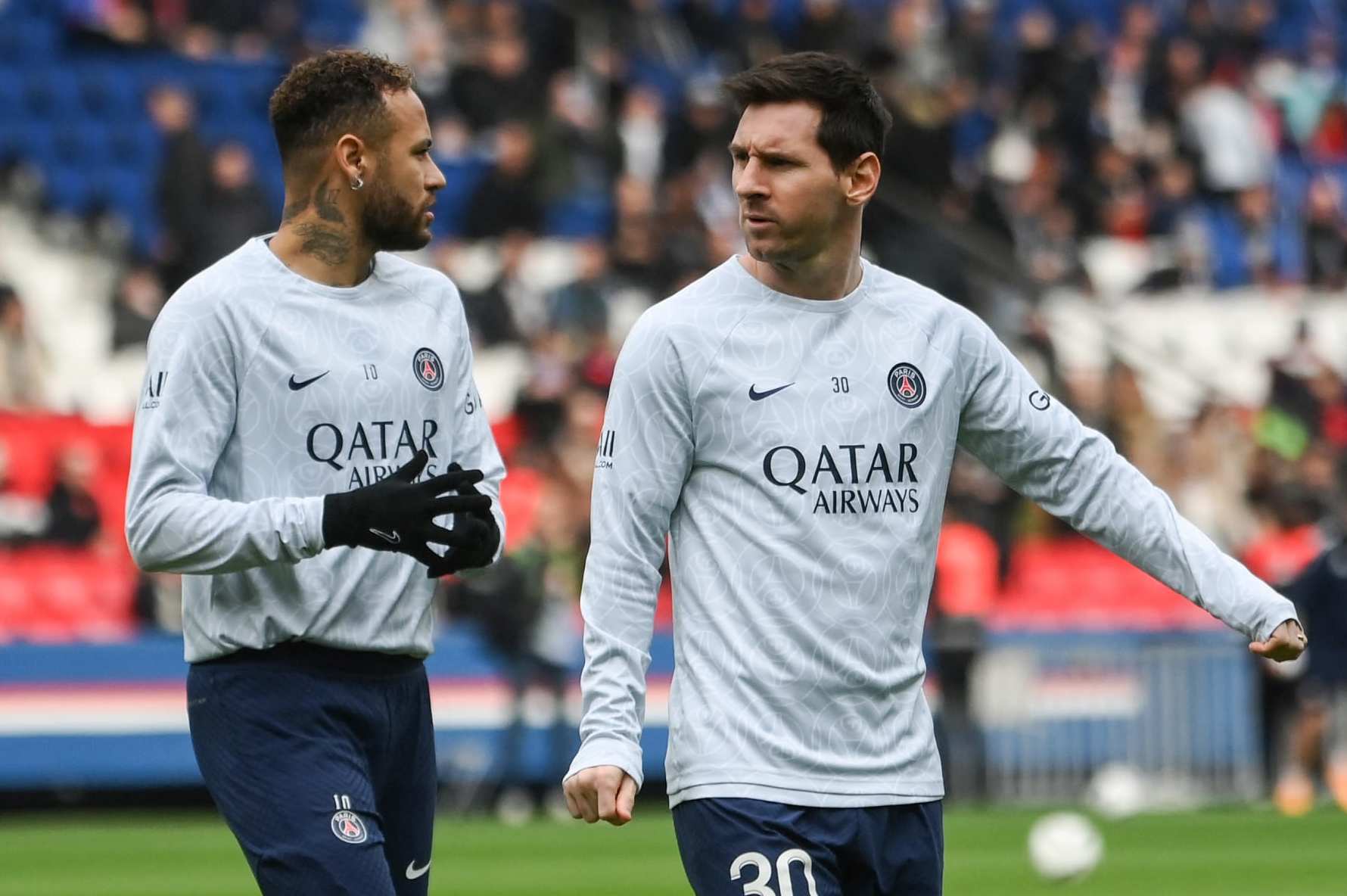 Paris Saint-Germain's Argentine forward Lionel Messi (R) and Paris Saint-Germain's Brazilian forward Neymar (L) warm up prior to the French L1 football match between Paris Saint-Germain (PSG) and Lille LOSC at The Parc des Princes Stadium in Paris on February 19, 2023. (Photo by FRANCK FIFE / AFP) (Photo by FRANCK FIFE/AFP via Getty Images)