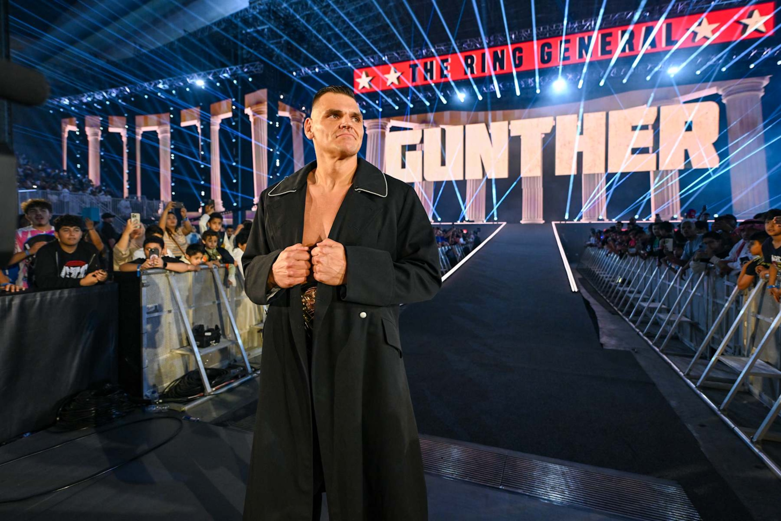 RIYADH, SAUDI ARABIA - NOVEMBER 2: The World Heavyweight Champion, GUNTHER enters the arena during Crown Jewel at Mohammed Abdo Arena on November 2, 2024 in Riyadh, Saudi Arabia. (Photo by WWE/Getty Images) RIYADH, SAUDI ARABIA - NOVEMBER 2: The World Heavyweight Champion, GUNTHER enters the arena during Crown Jewel at Mohammed Abdo Arena on November 2, 2024 in Riyadh, Saudi Arabia. (Photo by WWE/Getty Images)
