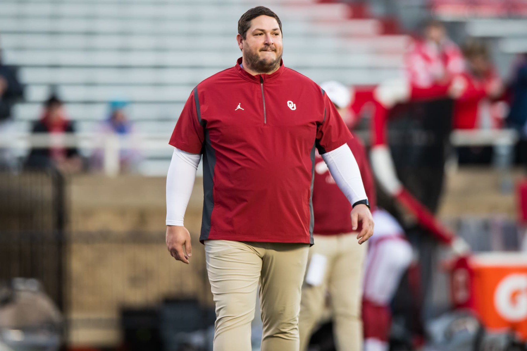 LUBBOCK, TEXAS - NOVEMBER 26: Offensive coordinator Jeff Lebby of the Oklahoma Sooners walks across the field before the game against the Texas Tech Red Raiders at Jones AT&T Stadium on November 26, 2022 in Lubbock, Texas. (Photo by John E. Moore III/Getty Images)