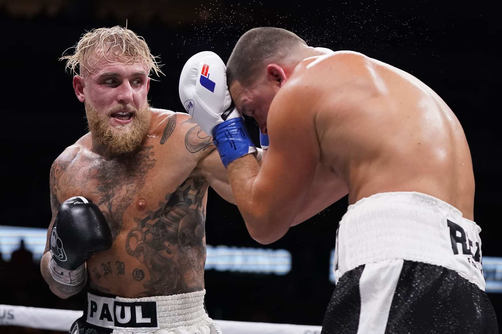 DALLAS, TEXAS - AUGUST 05: Jake Paul throws a left at Nate Diaz during the third round of their fight at the American Airlines Center on August 05, 2023 in Dallas, Texas. (Photo by Sam Hodde/Getty Images) DALLAS, TEXAS - AUGUST 05: Jake Paul throws a left at Nate Diaz during the third round of their fight at the American Airlines Center on August 05, 2023 in Dallas, Texas. (Photo by Sam Hodde/Getty Images)