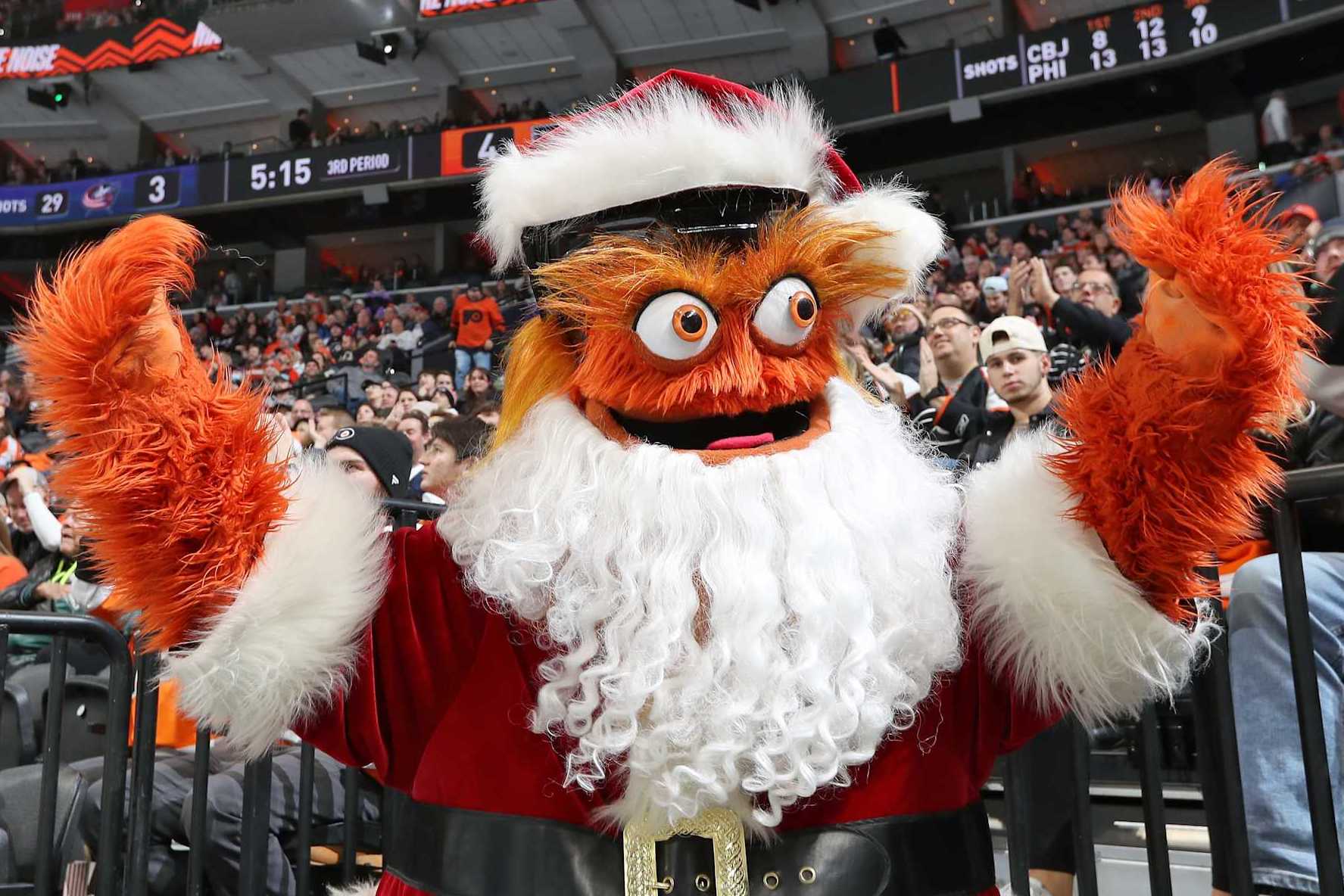 PHILADELPHIA, PENNSYLVANIA - DECEMBER 20: Gritty the mascot of the Philadelphia Flyers dressed as Santa Clause entertains the crowd during an NHL game against the Columbus Blue Jackets at the Wells Fargo Center on December 20, 2022 in Philadelphia, Pennsylvania. (Photo by Len Redkoles/NHLI via Getty Images)