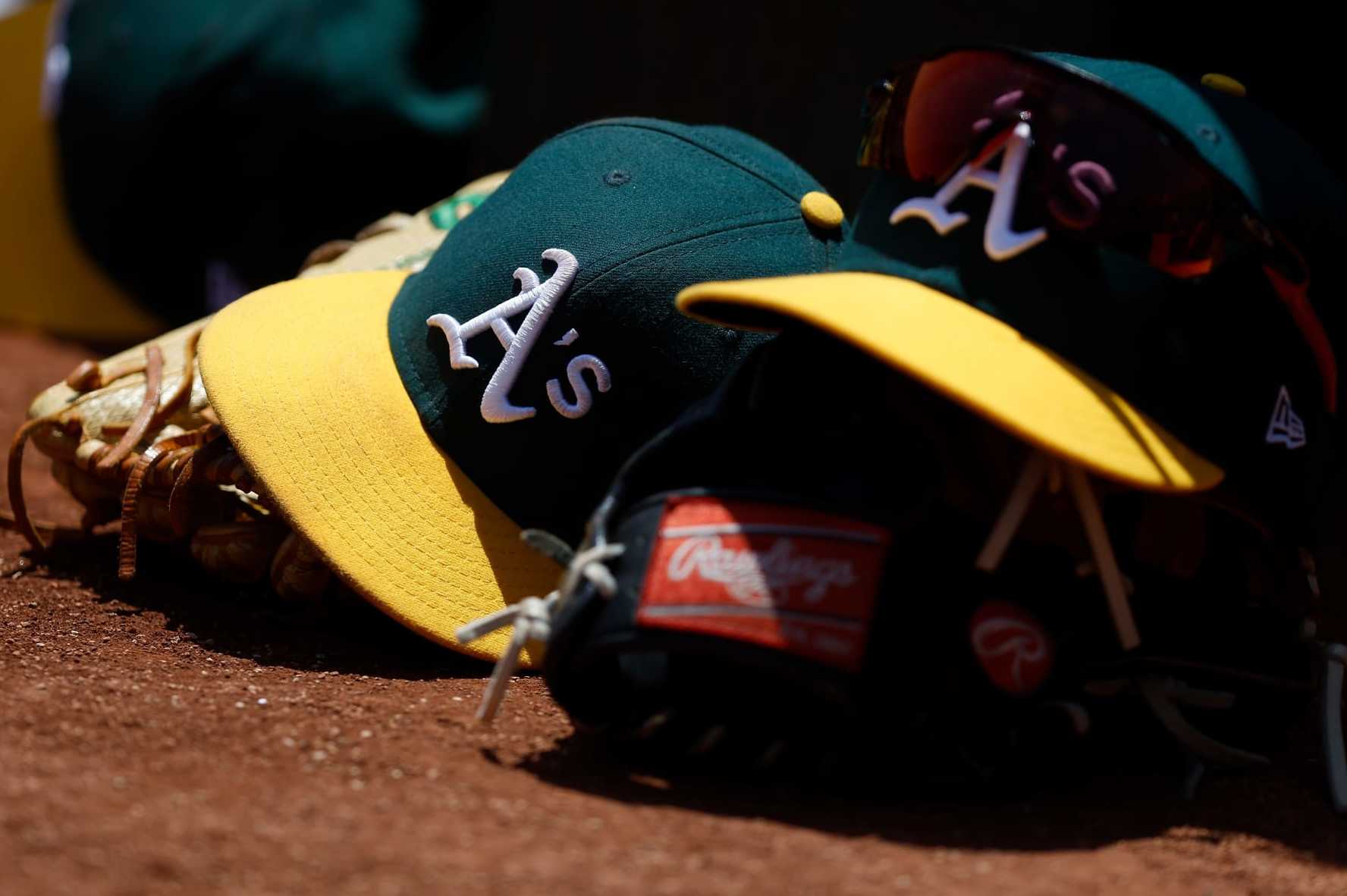 OAKLAND, CALIFORNIA - MAY 31: A detail shot of Oakland Athletics hats sitting in the dugout during the game against the Atlanta Braves at RingCentral Coliseum on May 31, 2023 in Oakland, California. (Photo by Lachlan Cunningham/Getty Images)