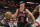 MIAMI, FL - APRIL 14: Alex Caruso #6 of the Chicago Bulls passes the ball while being defended by Bam Adebayo #13 of the Miami Heat during the second quarter at Kaseya Center on April 14, 2023 in Miami, Florida. NOTE TO USER: User expressly acknowledges and agrees that, by downloading and or using this Photograph, user is consenting to the terms and conditions of the Getty Images License Agreement. (Photo by Bryan Cereijo/Getty Images)