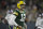 Green Bay Packers' Aaron Rodgers looks at the sc oreboard during the second half of an NFL football game against the Seattle Seahawks Sunday, Nov. 14, 2021, in Green Bay, Wis. (AP Photo/Aaron Gash)