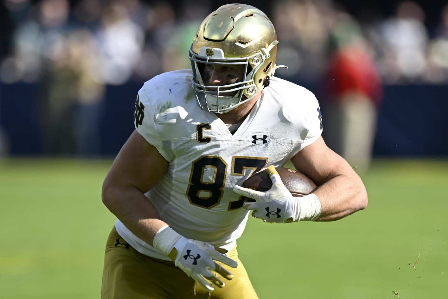 BALTIMORE, MARYLAND - NOVEMBER 12: Michael Mayer #87 of the Notre Dame Fighting Irish runs with the ball after making a catch against the Navy Midshipmen at M&T Bank Stadium on November 12, 2022 in Baltimore, Maryland. (Photo by G Fiume/Getty Images)