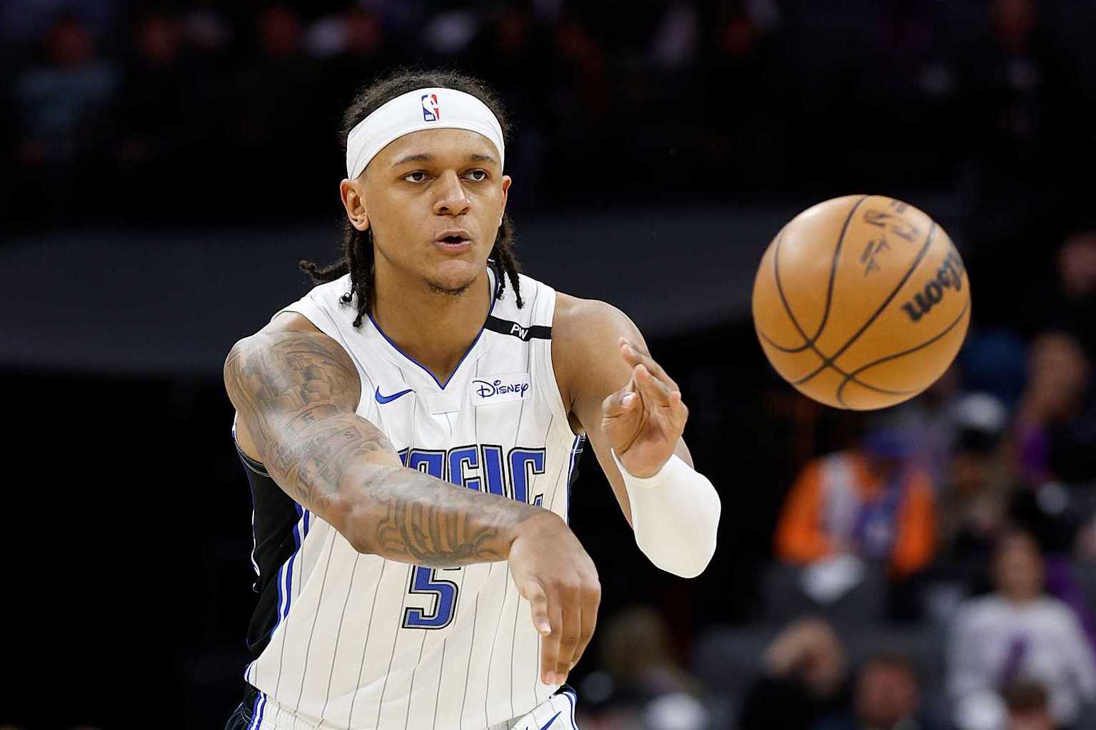 SACRAMENTO, CALIFORNIA - FEBRUARY 05: Paolo Banchero #5 of the Orlando Magic passes the ball against the Sacramento Kings during the second half of an NBA basketball game at Golden 1 Center on February 05, 2025 in Sacramento, California. NOTE TO USER: User expressly acknowledges and agrees that, by downloading and or using this photograph, User is consenting to the terms and conditions of the Getty Images License Agreement. (Photo by Thearon W. Henderson/Getty Images)