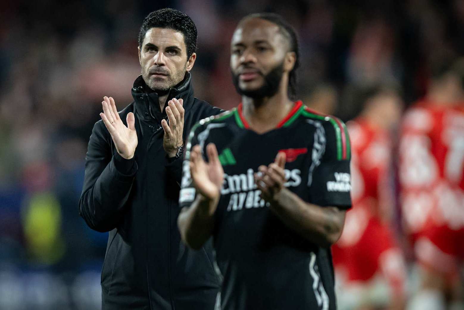 Mikel Arteta and Raheem Sterling.