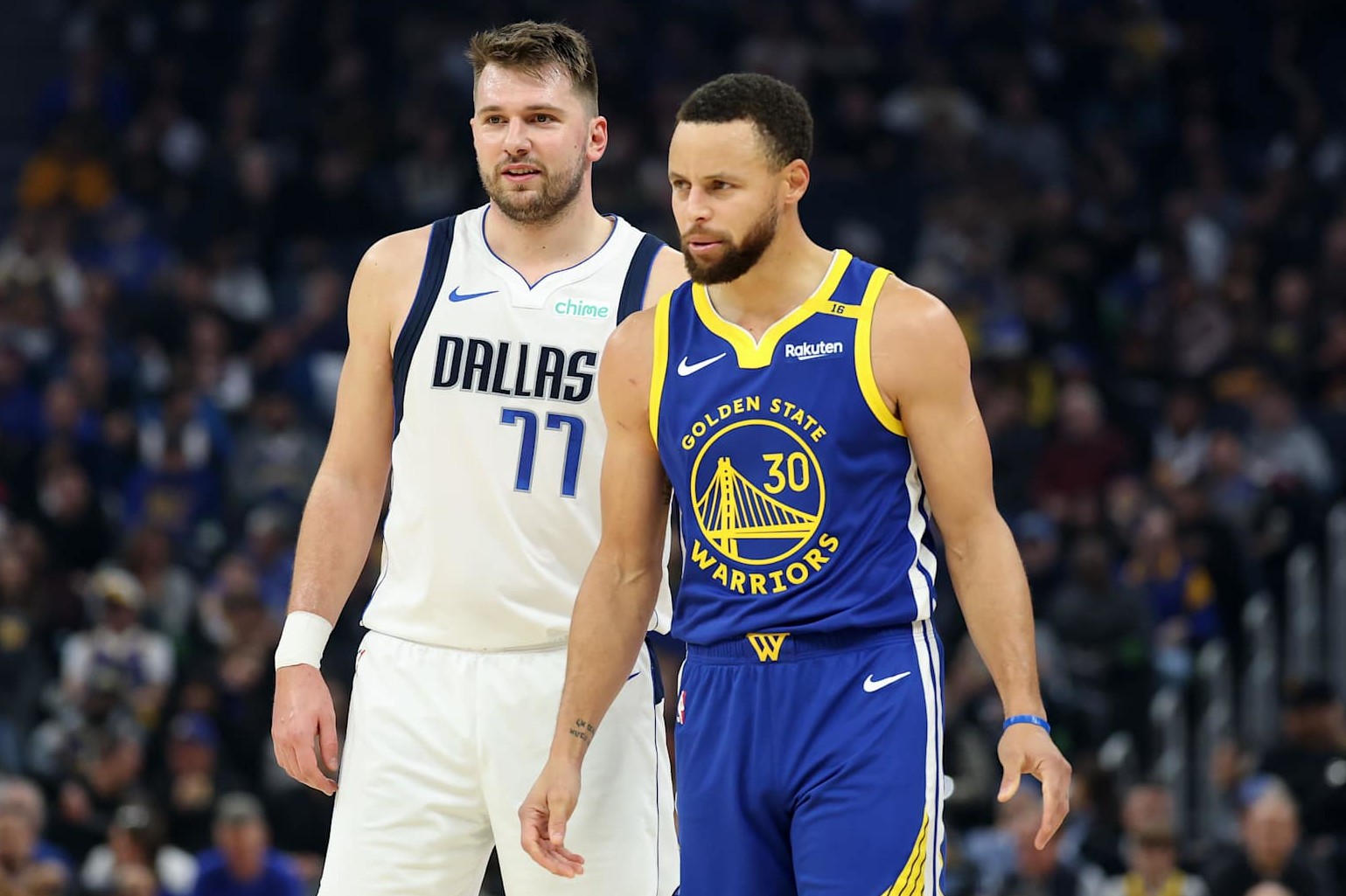 SAN FRANCISCO, CALIFORNIA - DECEMBER 15: Stephen Curry #30 of the Golden State Warriors and Luka Doncic #77 of the Dallas Mavericks stand on the court at Chase Center on December 15, 2024 in San Francisco, California. NOTE TO USER: User expressly acknowledges and agrees that, by downloading and/or using this photograph, user is consenting to the terms and conditions of the Getty Images License Agreement. (Photo by Ezra Shaw/Getty Images)