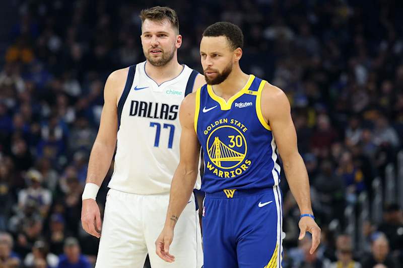 SAN FRANCISCO, CALIFORNIA - DECEMBER 15: Stephen Curry #30 of the Golden State Warriors and Luka Doncic #77 of the Dallas Mavericks stand on the court at Chase Center on December 15, 2024 in San Francisco, California.  NOTE TO USER: User expressly acknowledges and agrees that, by downloading and/or using this photograph, user is consenting to the terms and conditions of the Getty Images License Agreement.   (Photo by Ezra Shaw/Getty Images)