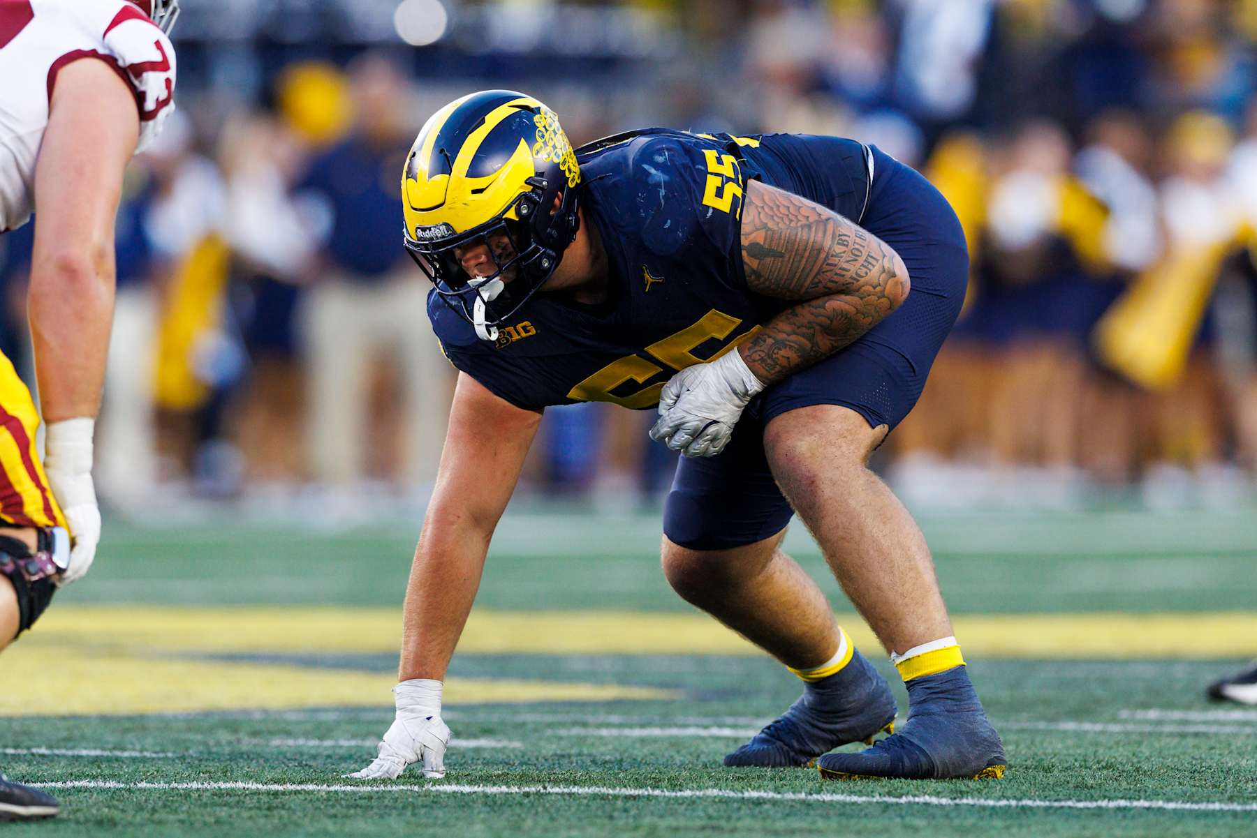ANN ARBOR, MICHIGAN - SEPTEMBER 21: Mason Graham #55 of the Michigan Wolverines in a defensive stance during the second half against USC Trojans at Michigan Stadium on September 21, 2024 in Ann Arbor, Michigan. (Photo by Ric Tapia/Getty Images)