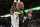 Memphis Grizzlies guard Ja Morant shoots against Phoenix Suns center Deandre Ayton (22) in the second half of an NBA basketball game, Tuesday, Dec. 27, 2022, in Memphis, Tenn. (AP Photo/Brandon Dill)