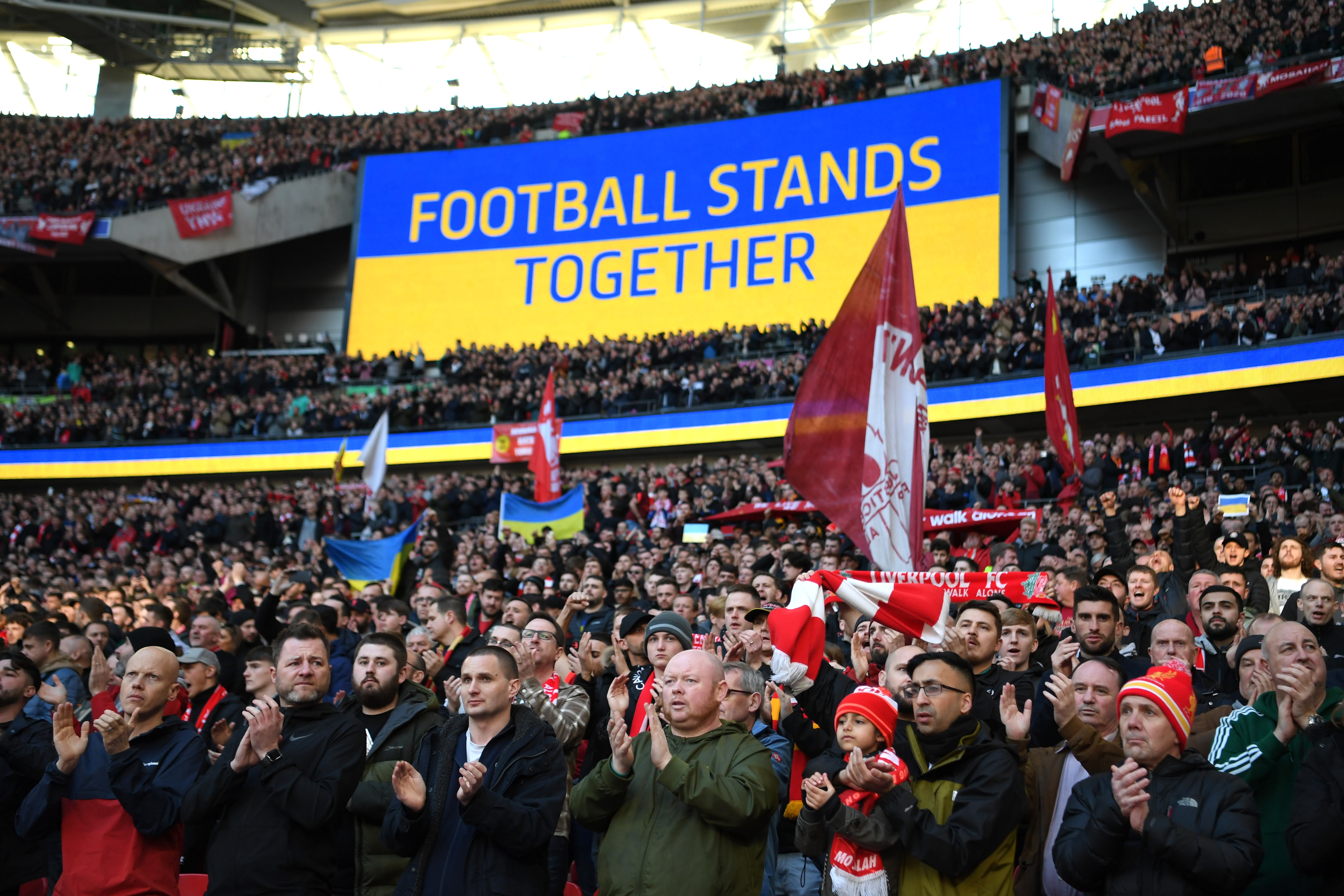 LONDON, ENGLAND - FEBRUARY 27: Liverpool fans hold banners in support of Ukraine to indicate peace and sympathy with Ukraine prior to the Carabao Cup Final match between Chelsea and Liverpool at Wembley Stadium on February 27, 2022 in London, England. (Photo by Shaun Botterill/Getty Images)
