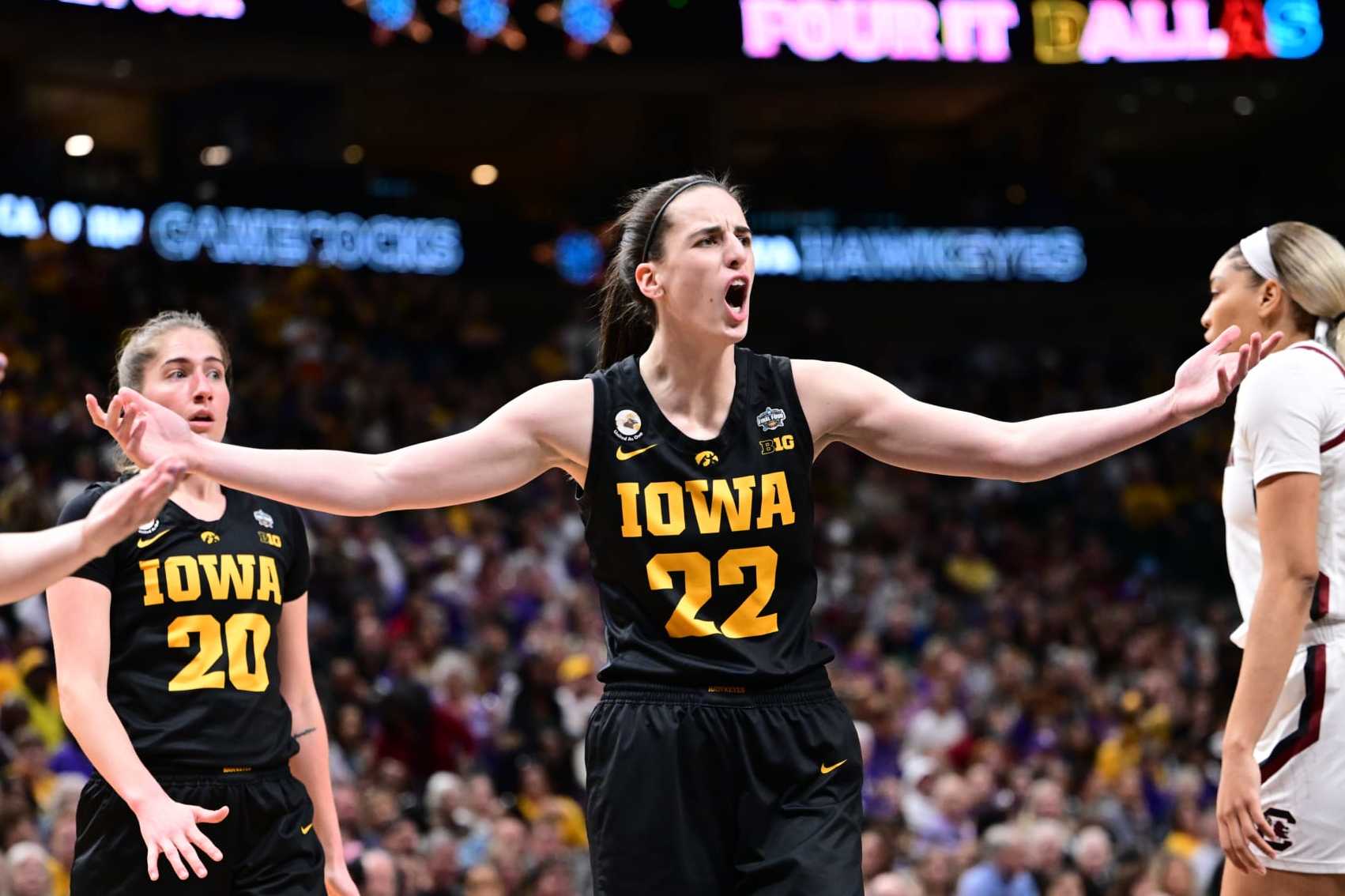 DALLAS, TX - MARCH 31: Caitlin Clark #22 of the Iowa Hawkeyes reacts to a playa against the South Carolina Gamecocks during the semifinals of the NCAA Womens Basketball Tournament Final Four at American Airlines Center on March 31, 2023 in Dallas, Texas. (Photo by Ben Solomon/NCAA Photos via Getty Images)