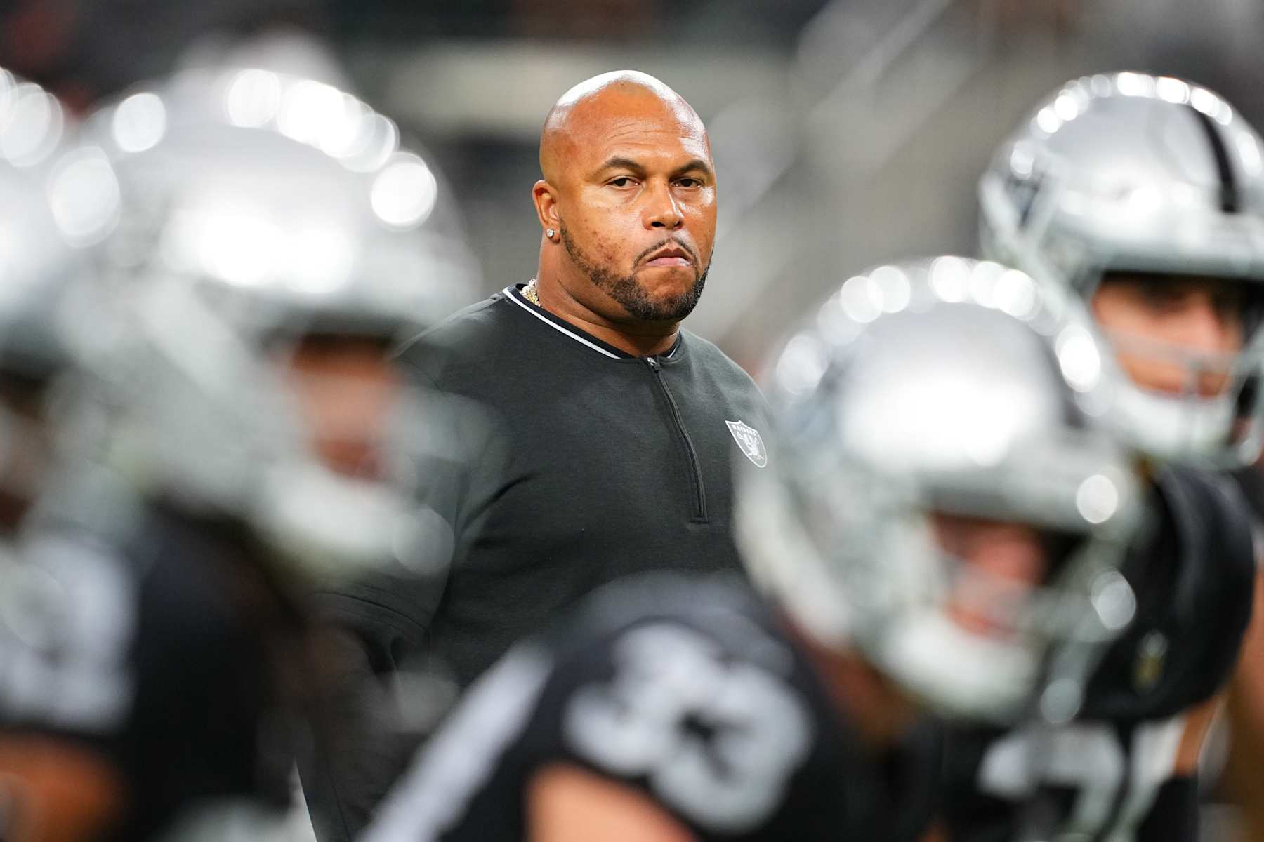 LAS VEGAS, NEVADA - AUGUST 17:  Head coach Antonio Pierce of the Las Vegas Raiders looks on during warmups before a preseason game against the Dallas Cowboys at Allegiant Stadium on August 17, 2024 in Las Vegas, Nevada.  (Photo by Chris Unger/Getty Images)