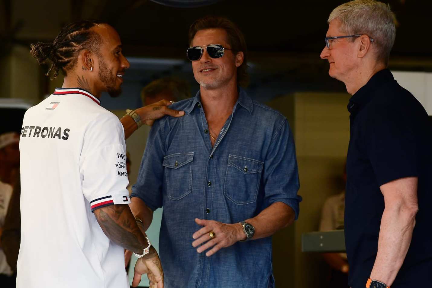 AUSTIN, TEXAS - OCTOBER 23: Lewis Hamilton of Great Britain and Mercedes meets Brad Pitt and Tim Cook in the garage prior to the F1 Grand Prix of USA at Circuit of The Americas on October 23, 2022 in Austin, Texas. (Photo by Mario Renzi - Formula 1/Formula 1 via Getty Images)