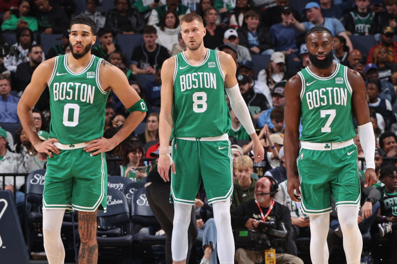 MEMPHIS, TN - NOVEMBER 19: Kristaps Porzingis #8, Jayson Tatum #0, and Jaylen Brown #7 of the Boston Celtics look on during the game against the Memphis Grizzlies on November 19, 2023 at FedExForum in Memphis, Tennessee. NOTE TO USER: User expressly acknowledges and agrees that, by downloading and or using this photograph, User is consenting to the terms and conditions of the Getty Images License Agreement. Mandatory Copyright Notice: Copyright 2023 NBAE (Photo by Joe Murphy/NBAE via Getty Images)