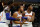 MILWAUKEE, WISCONSIN - OCTOBER 28: Jalen Brunson #11 of the New York Knicks is held back by Julius Randle #30 and RJ Barrett #9 of the New York Knicks after being called for a foul during the first half of the game at Fiserv Forum on October 28, 2022 in Milwaukee, Wisconsin. NOTE TO USER: User expressly acknowledges and agrees that, by downloading and or using this photograph, User is consenting to the terms and conditions of the Getty Images License Agreement. (Photo by John Fisher/Getty Images)