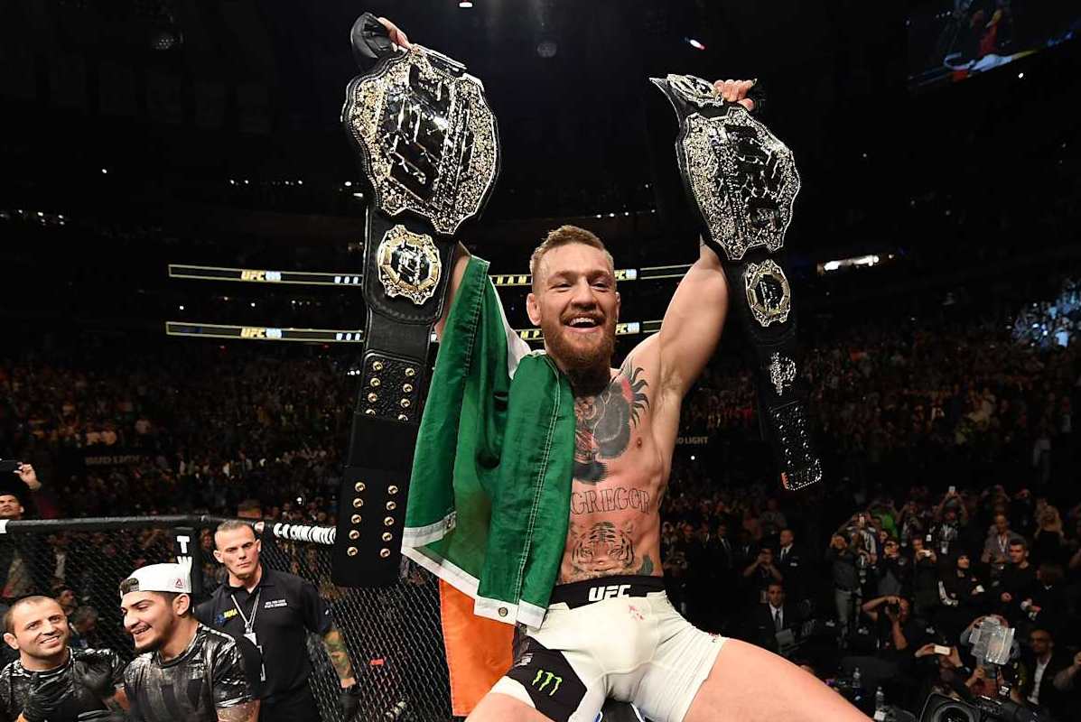 NEW YORK, NY - NOVEMBER 12: UFC lightweight and featherweight champion Conor McGregor of Ireland celebrates after defeating Eddie Alvarez in their UFC lightweight championship fight during the UFC 205 event at Madison Square Garden on November 12, 2016 in New York City. (Photo by Jeff Bottari/Zuffa LLC/Zuffa LLC via Getty Images)
