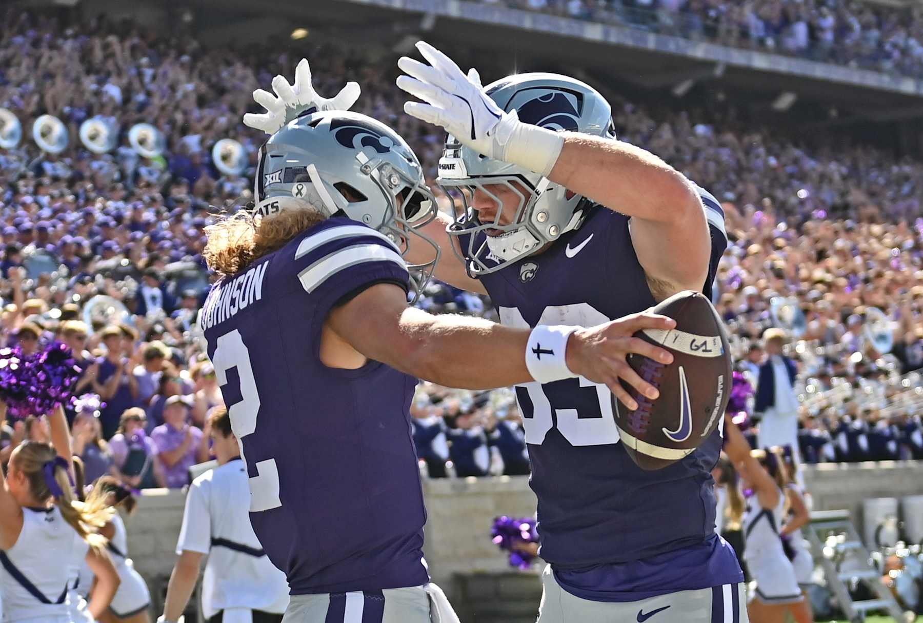 Quarterback Avery Johnson #2 of the Kansas State Wildcats celebrates with tight end Will Swanson