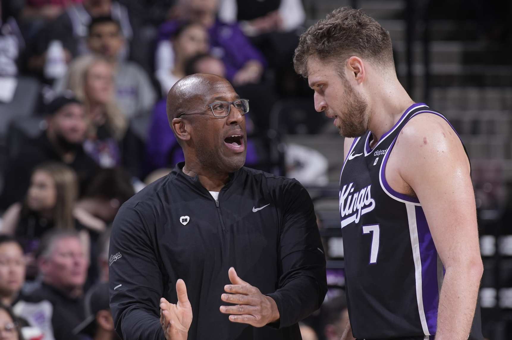 SACRAMENTO, CA - MARCH 31: Head Coach Mike Brown of the Sacramento Kings coaches Sasha Vezenkov #7 during the game against the Utah Jazz on March 31, 2024 at Golden 1 Center in Sacramento, California. NOTE TO USER: User expressly acknowledges and agrees that, by downloading and or using this photograph, User is consenting to the terms and conditions of the Getty Images Agreement. Mandatory Copyright Notice: Copyright 2024 NBAE (Photo by Rocky Widner/NBAE via Getty Images)