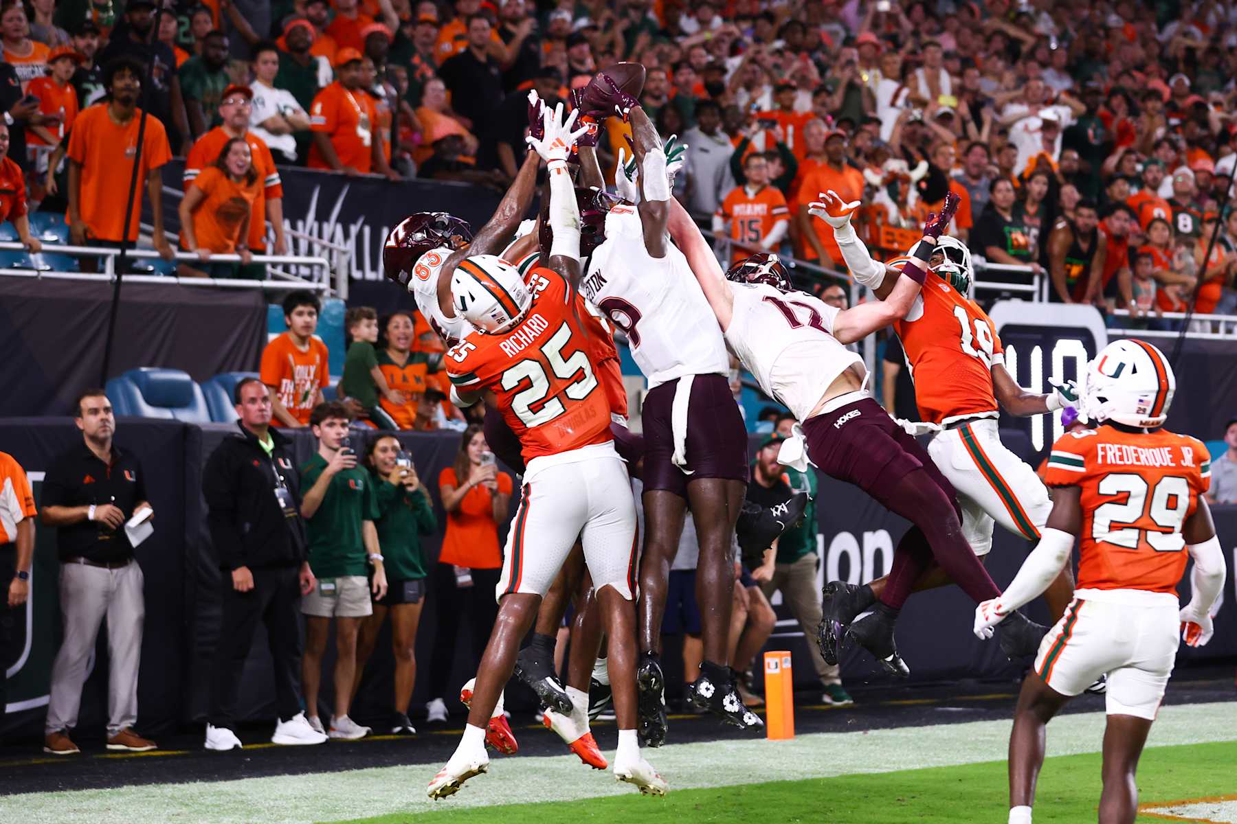 MIAMI GARDENS, FLORIDA - SEPTEMBER 27: Miami Hurricanes defenders break up a pass intended for Da'Quan Felton #9 of the Virginia Tech Hokies during the fourth quarter of the game at Hard Rock Stadium on September 27, 2024 in Miami Gardens, Florida. (Photo by Megan Briggs/Getty Images)