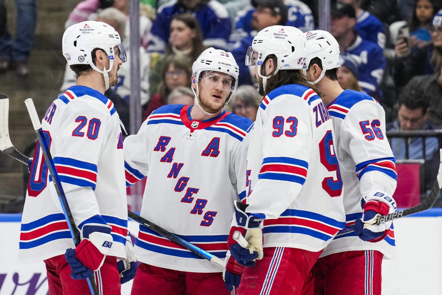 TORONTO, ON - MARCH 2: Adam Fox #23 of the New York Rangers talks with teammates Chris Kreider #20, Mika Zibanejad #93 and Erik Gustafsson #56 during the first period against the Toronto Maple Leafs at Scotiabank Arena on March 2, 2024 in Toronto, Ontario, Canada. (Photo by Andrew Lahodynskyj/NHLI via Getty Images)