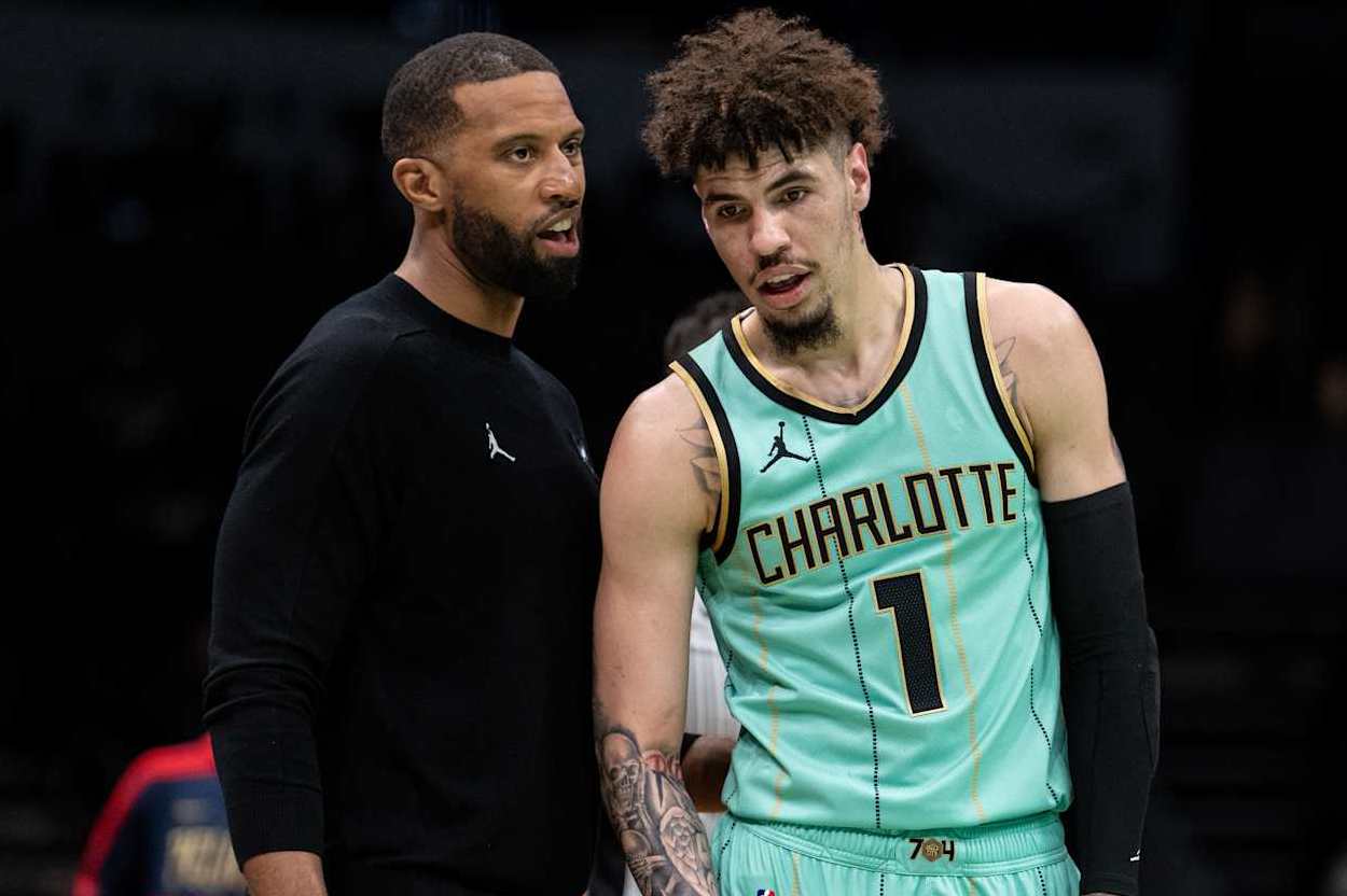CHARLOTTE, NORTH CAROLINA - JANUARY 25: Head coach Charles Lee of the Charlotte Hornets talks to LaMelo Ball #1 in the first quarter during their game against the New Orleans Pelicans at Spectrum Center on January 25, 2025 in Charlotte, North Carolina. NOTE TO USER: User expressly acknowledges and agrees that, by downloading and or using this photograph, User is consenting to the terms and conditions of the Getty Images License Agreement. (Photo by Jacob Kupferman/Getty Images)