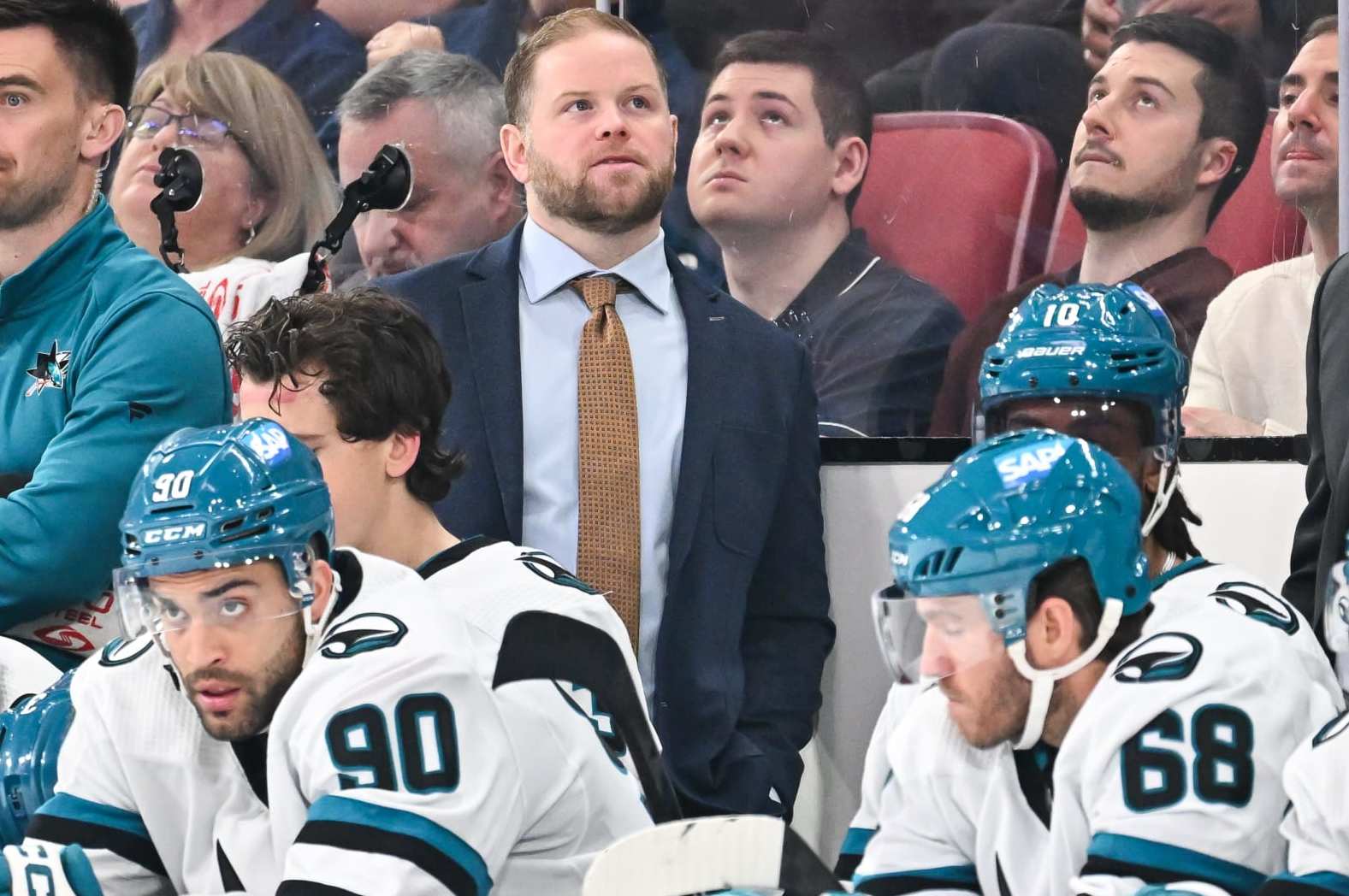 MONTREAL, CANADA - JANUARY 11:  Assistant coach of the San Jose Sharks Ryan Warsofsky, handles bench duties during the third period against the Montreal Canadiens at the Bell Centre on January 11, 2024 in Montreal, Quebec, Canada.  The San Jose Sharks defeated the Montreal Canadiens 3-2.  (Photo by Minas Panagiotakis/Getty Images)